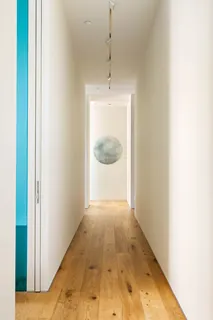 a view of a hallway with a chandelier