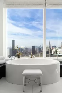 a living room with a table and chair