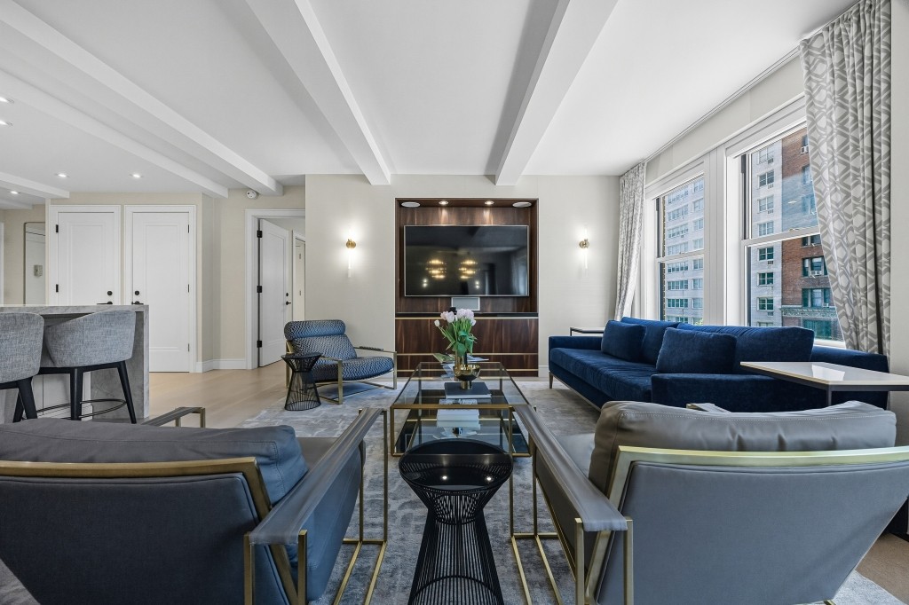 433 West 34th Street, Unit 4ABC Manhattan, NY 10001 - Photo 7 of 20 a living room with furniture and wooden floor