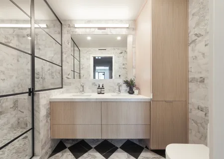 a bathroom with a sink and mirror