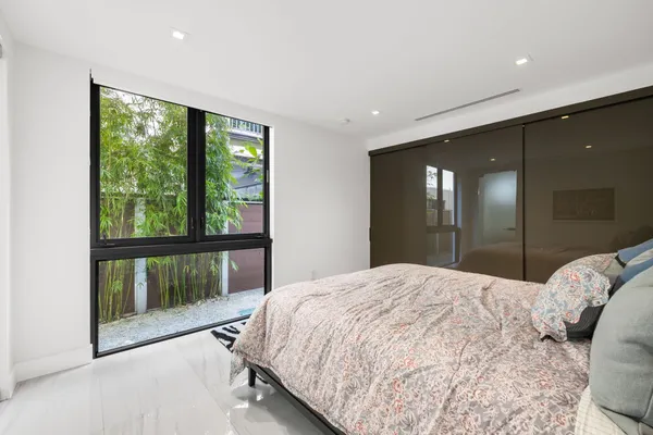 a bedroom with a bed and a view of bathroom