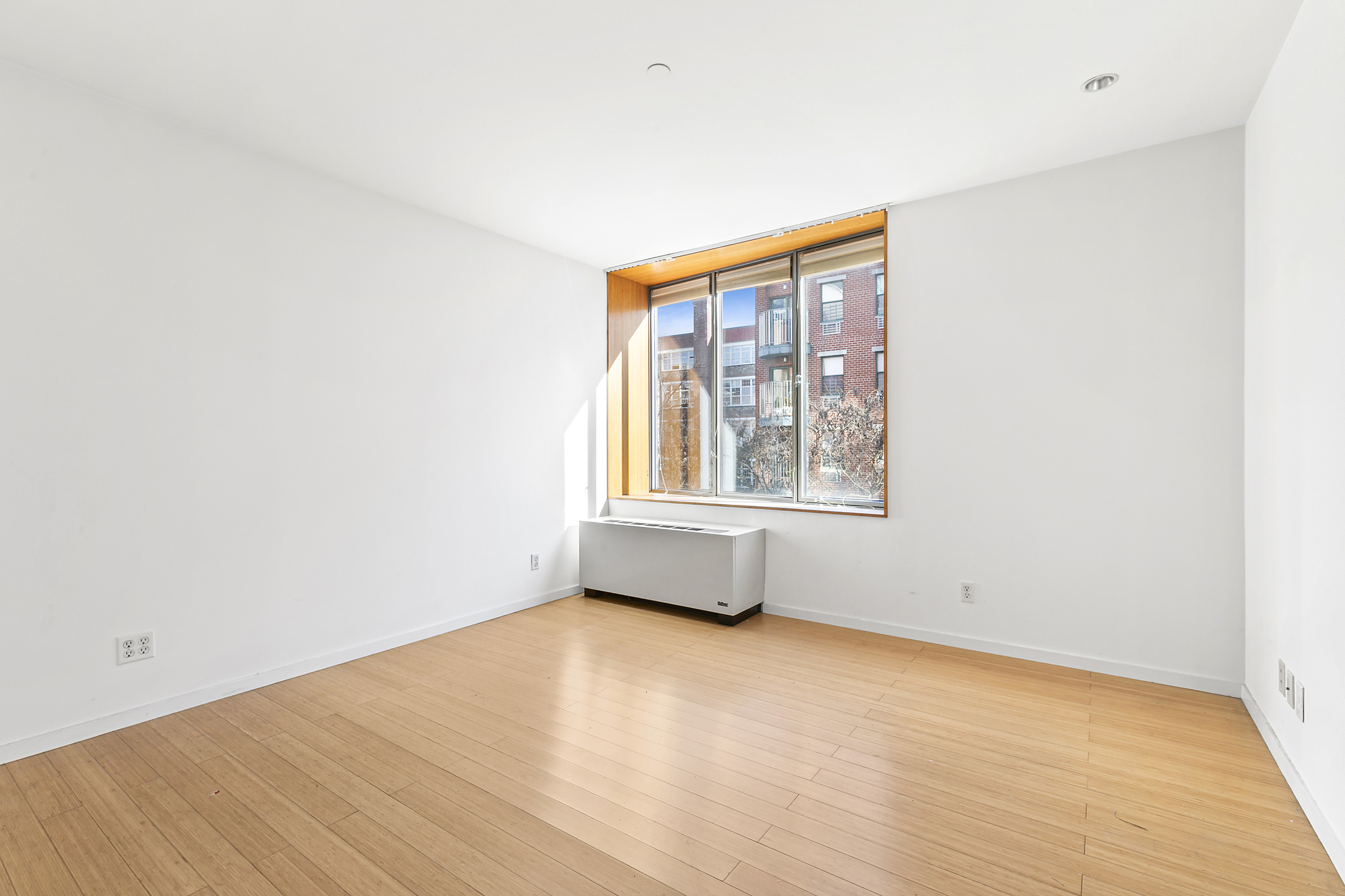 109 Norfolk Street, Unit 4 Manhattan, NY 10002 - Photo 5 of 7 an empty room with a window