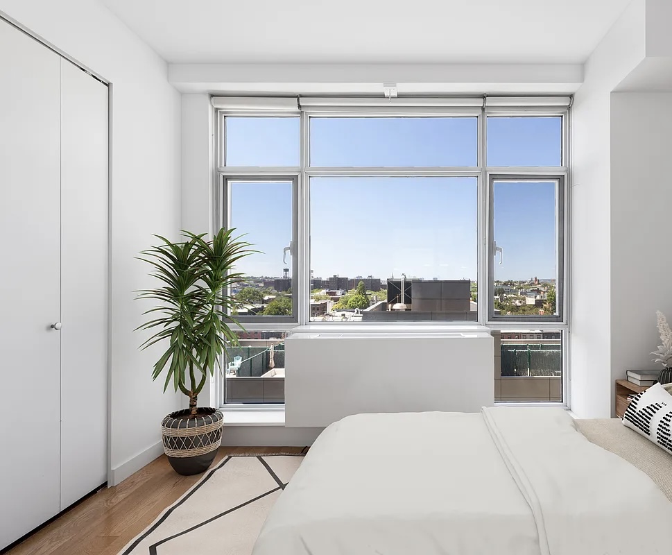 189 Schermerhorn Street, Unit 10B Brooklyn, NY 11201 - Photo 3 of 4 a room with a bed and a potted plant