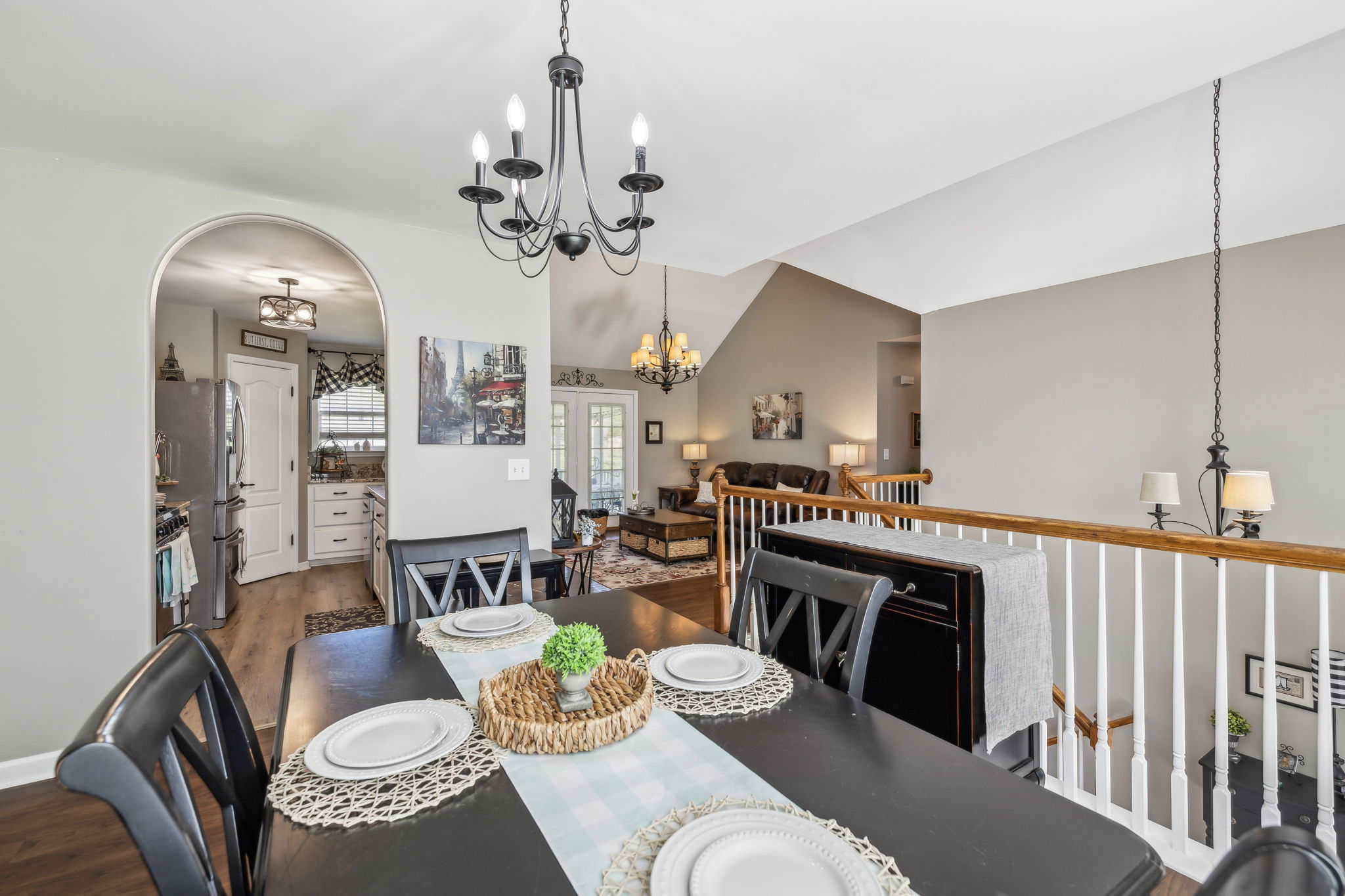 405 Billy Lane Spring Hill, TN 37174 - Photo 10 of 39 a living room with furniture a dining table and a chandelier