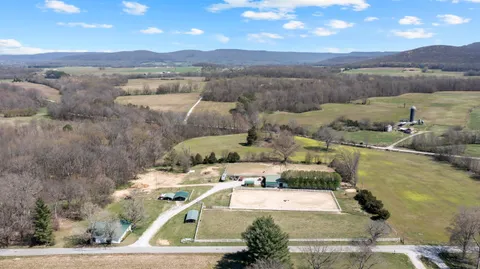 a view of a lake with couches and city view