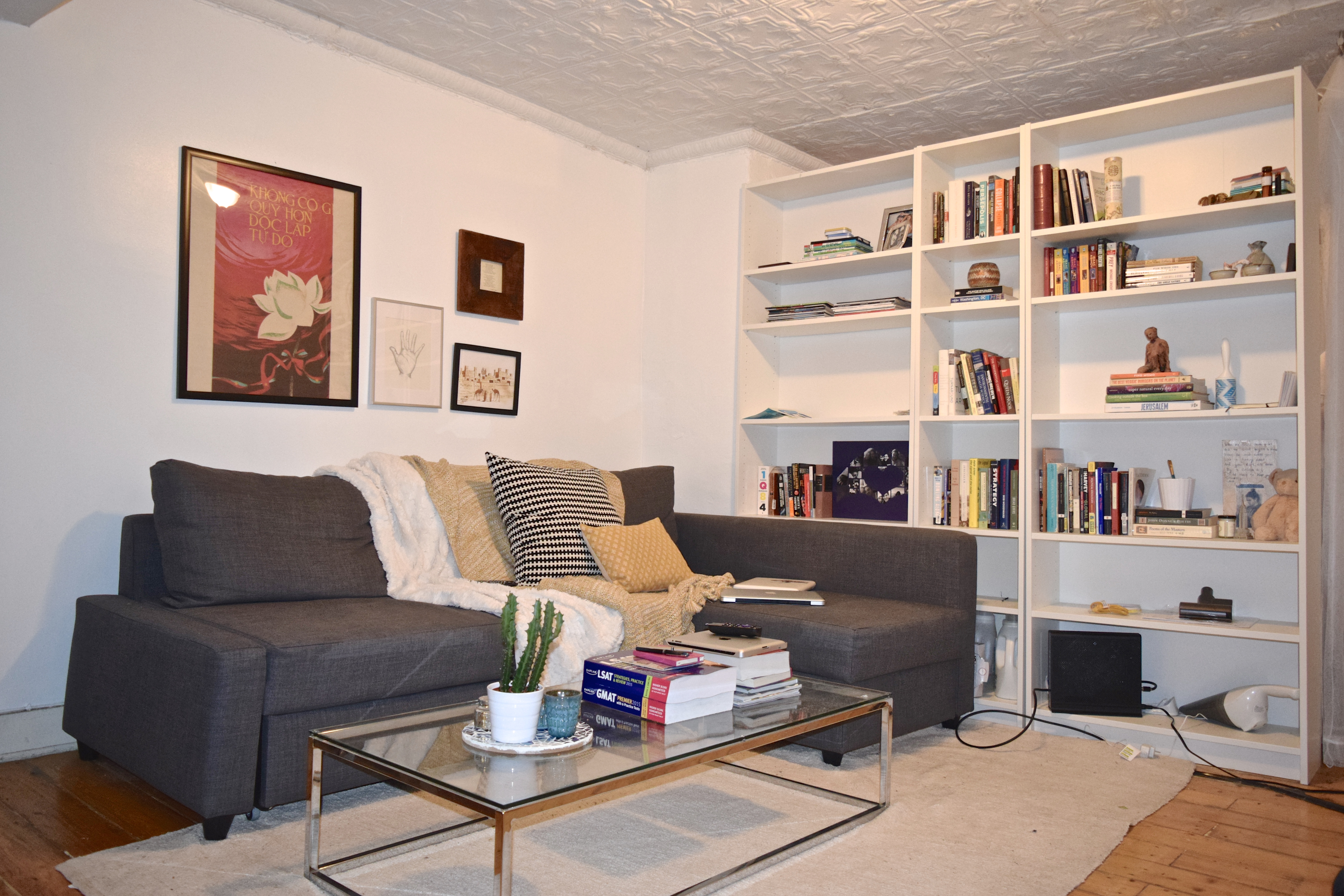 57 Duffield Street, Unit 1 Brooklyn, NY 11201 - Photo 2 of 7 a living room with furniture and a book shelf