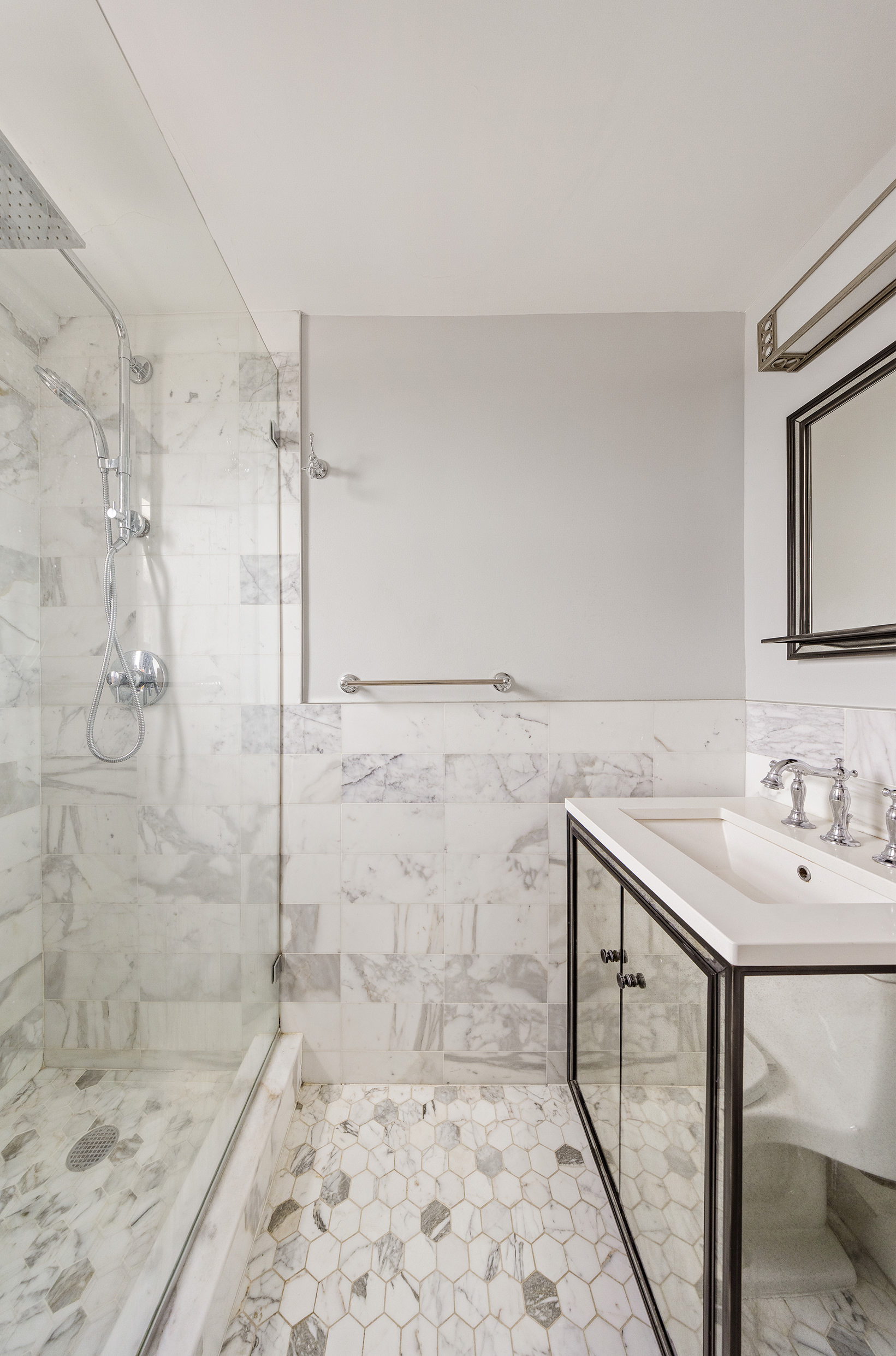 10 East End Avenue, Unit 18D Manhattan, NY 10075 - Photo 10 of 21 a bathroom with a sink a toilet and shower