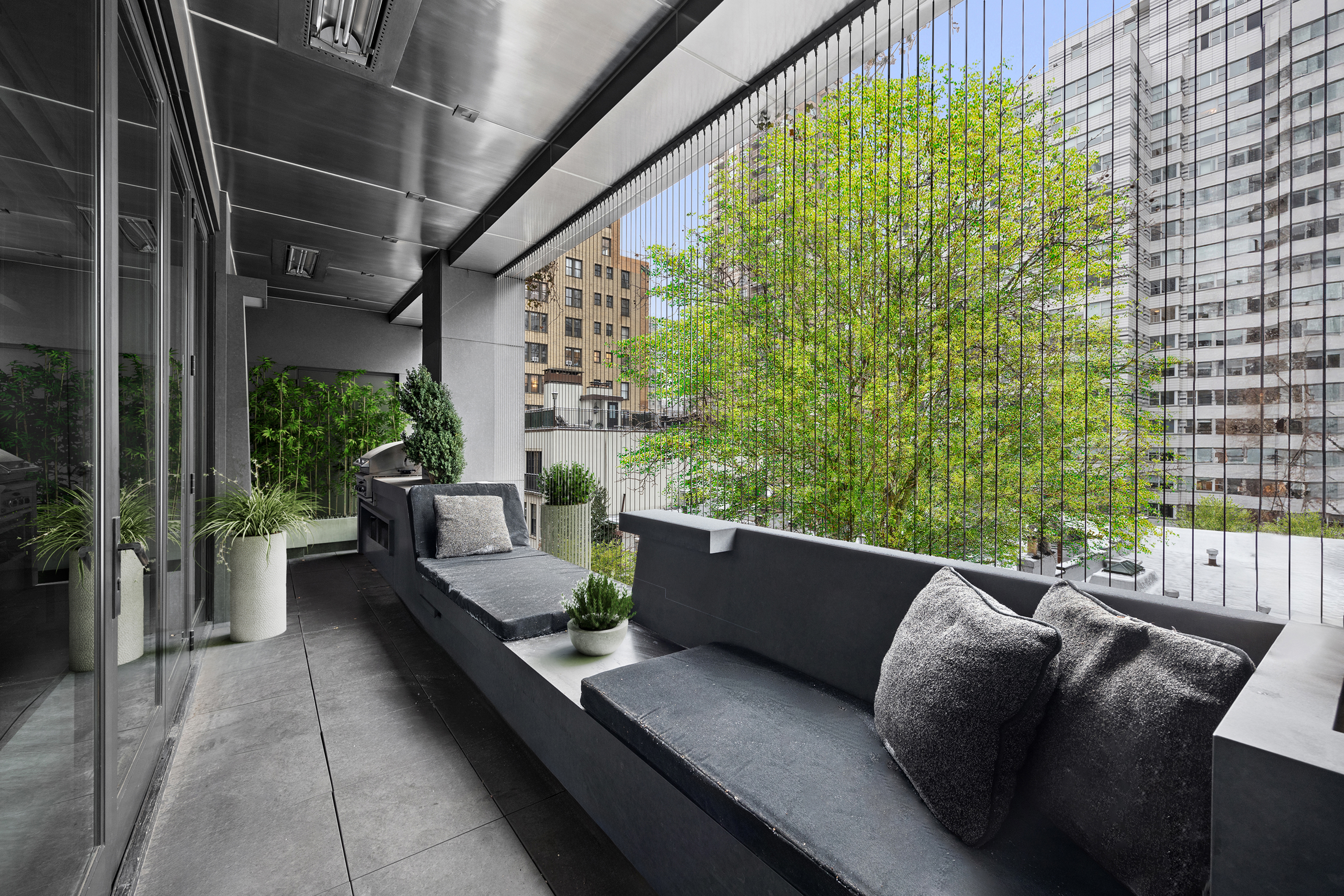 219 East 67th Street, Unit 5 Manhattan, NY 10065 - Photo 2 of 18 a living room with furniture and a potted plant