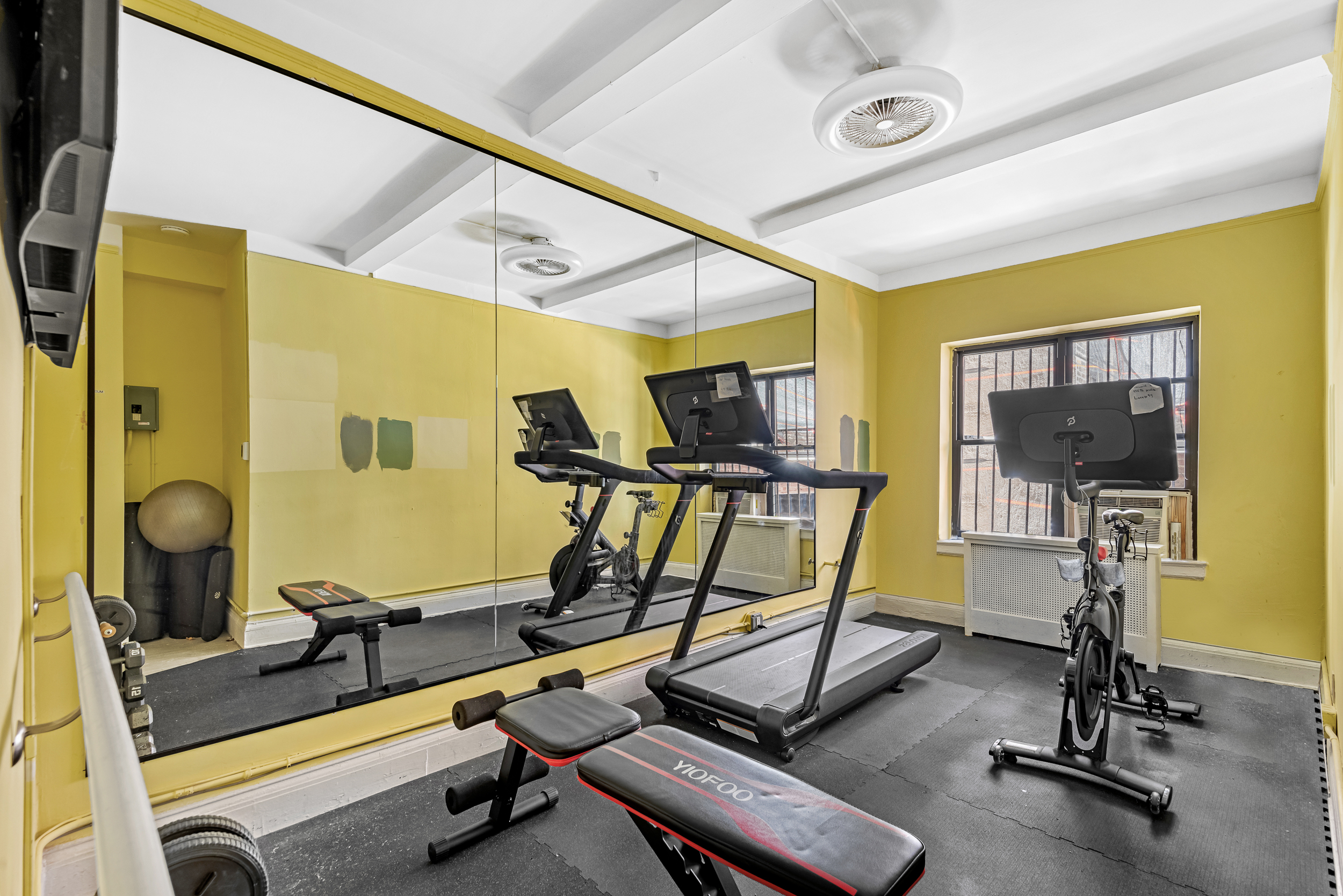 49 East 96th Street, Unit 4D Manhattan, NY 10128 - Photo 15 of 18 a view of a room with gym equipment