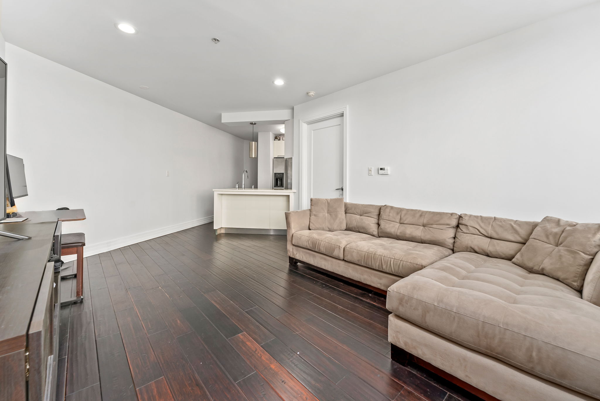 64-05 Yellowstone Boulevard, Unit 414 Queens, NY 11375 - Photo 9 of 14 a living room with furniture and a wooden floor