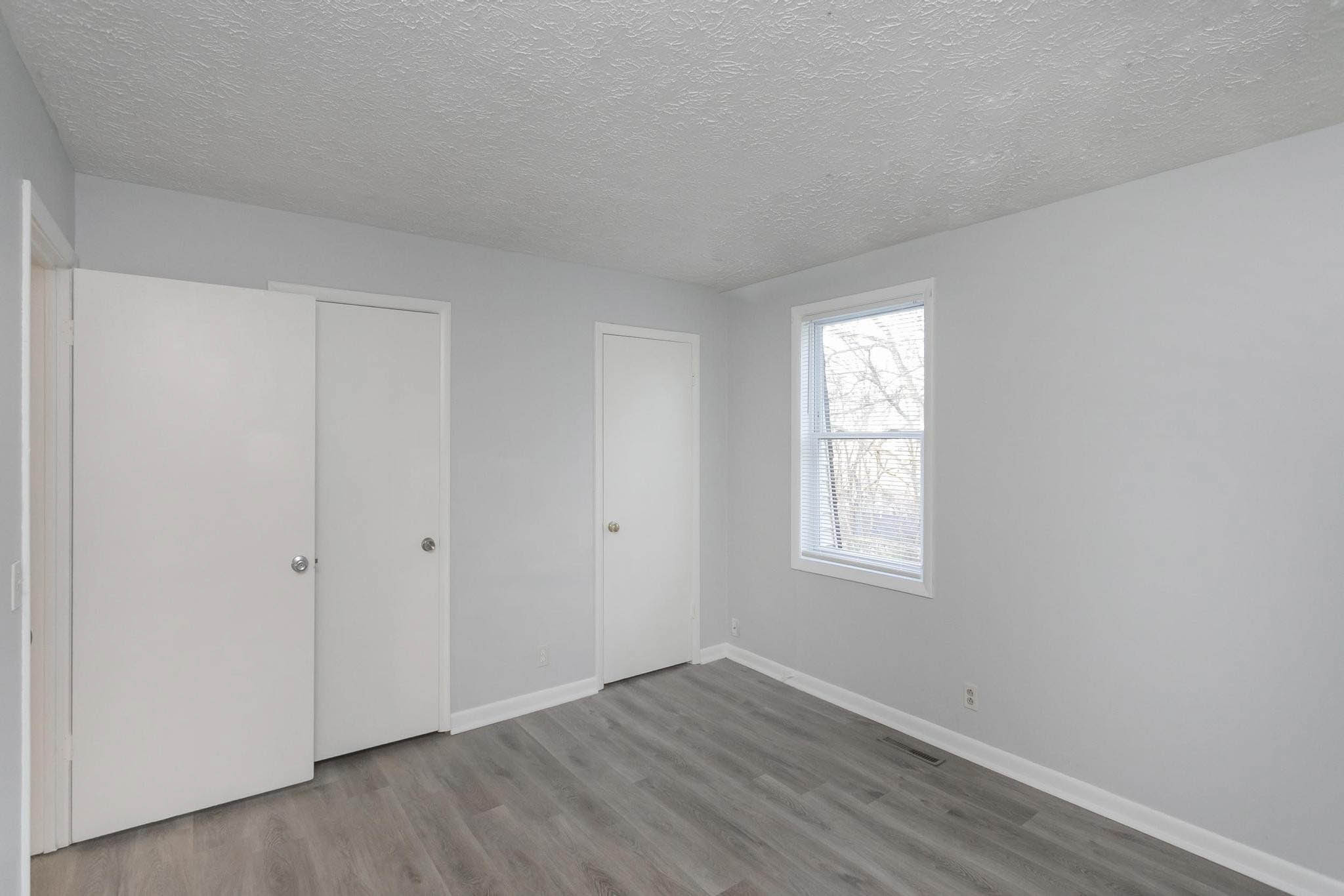 Falls Creek Drive, Unit 3307 & 3309 Nashville, TN 37214 - Photo 29 of 51 an empty room with wooden floor and window