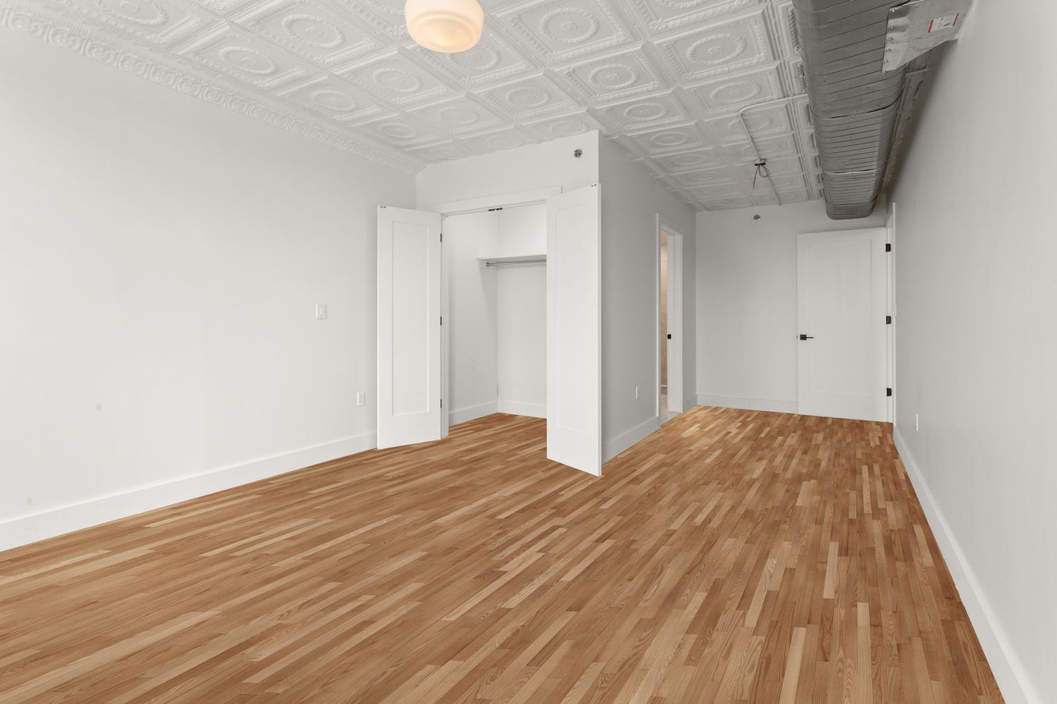 717 Manhattan Avenue, Unit 2A Brooklyn, NY 11222 - Photo 7 of 17 a view of empty room with wooden floor