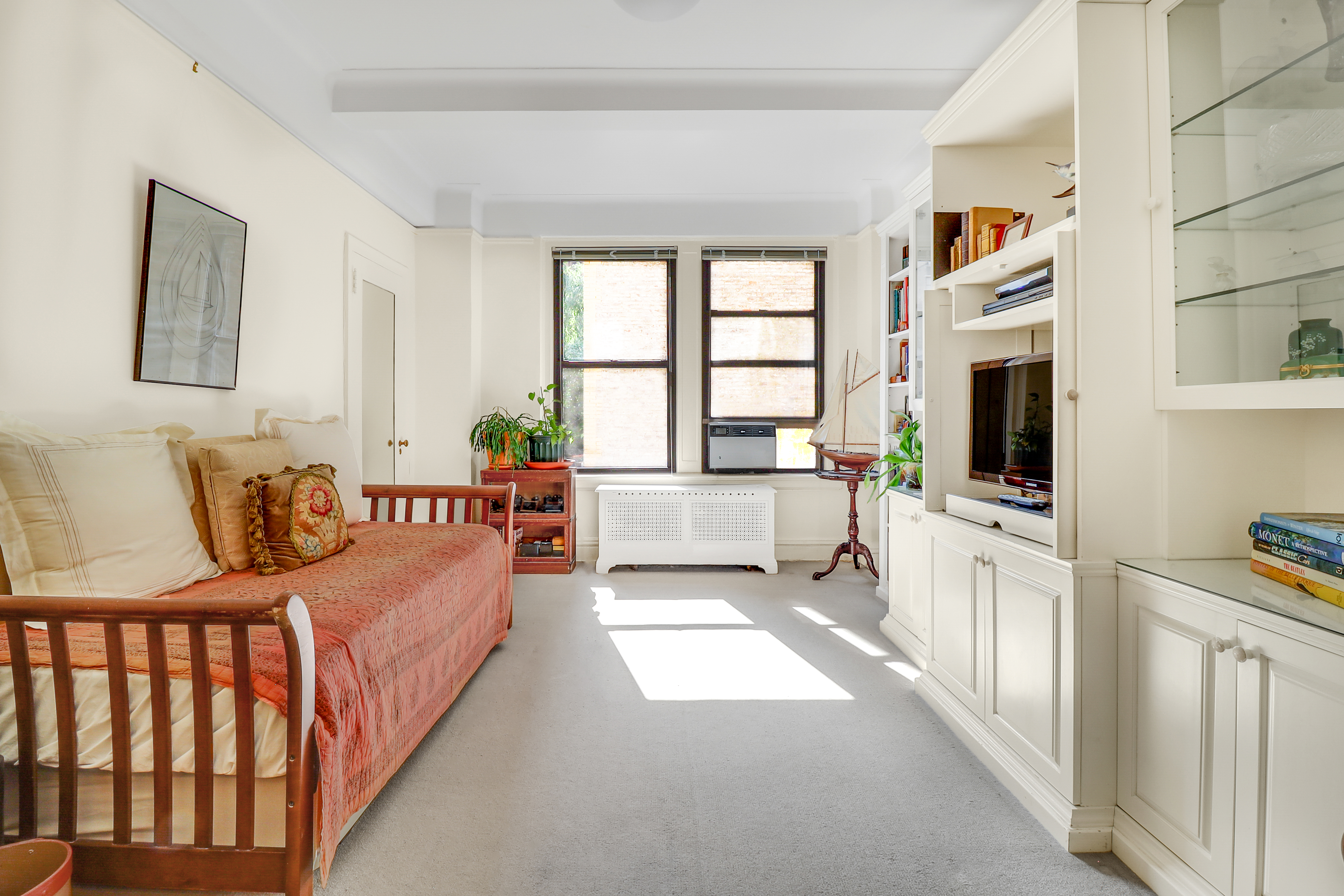 50 Riverside Drive, Unit 5E Manhattan, NY 10024 - Photo 11 of 22 a living room with furniture fireplace and flat screen tv