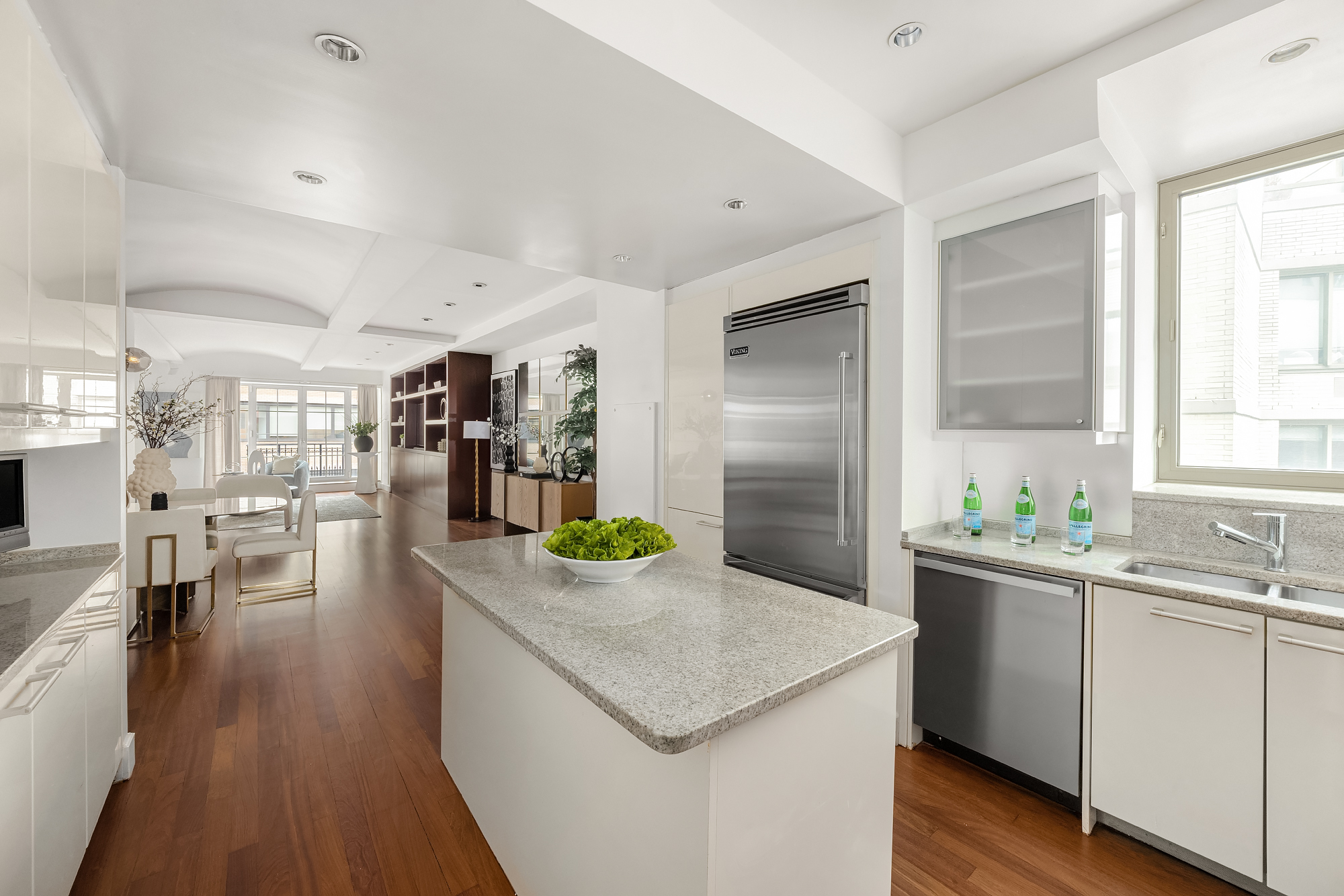 43 West 64th Street, Unit 7A Manhattan, NY 10023 - Photo 9 of 20 a kitchen with a sink a counter top space and stainless steel appliances