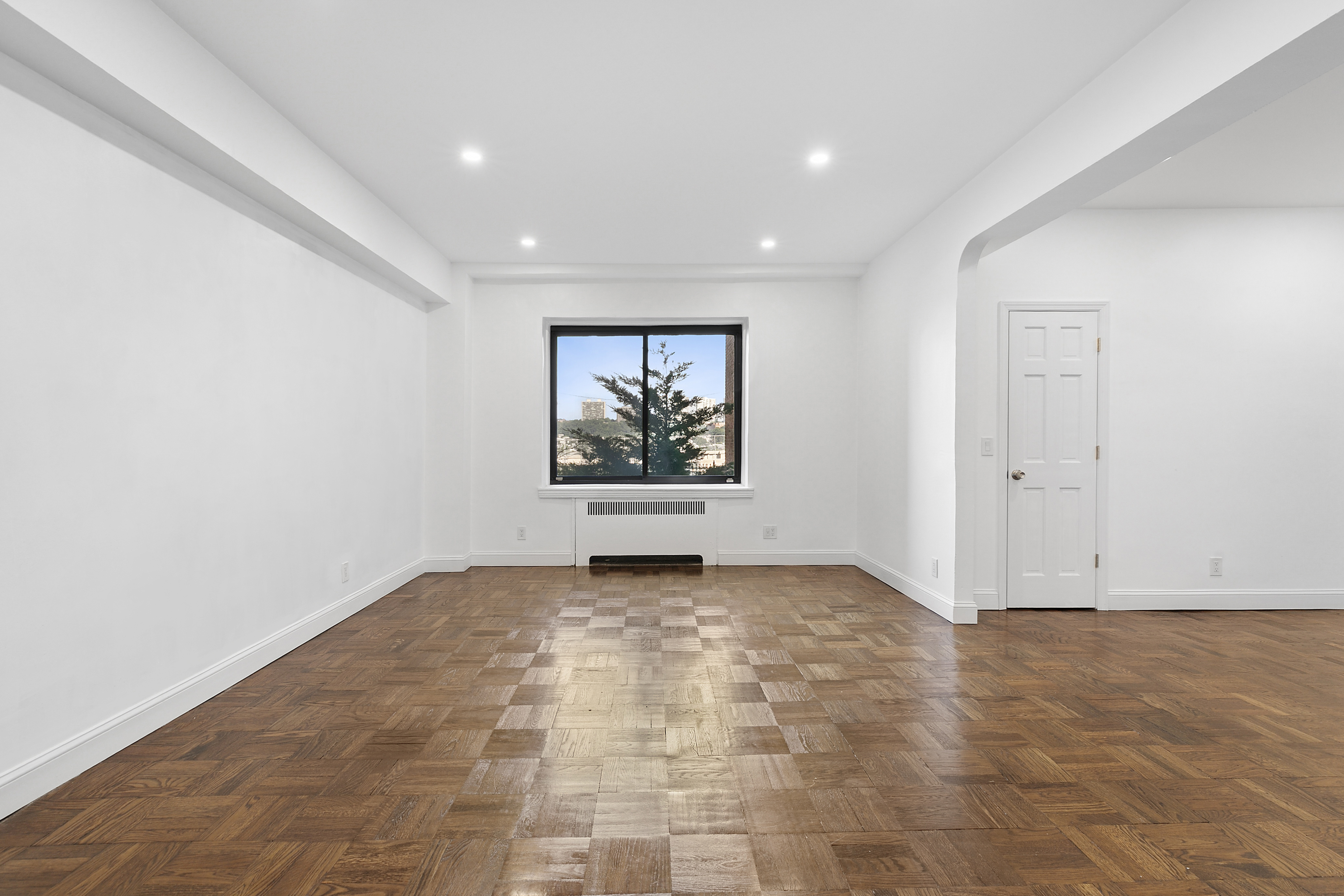 159-34 Riverside Drive West, Unit 1J90 Manhattan, NY 10032 - Photo 4 of 19 en empty room with window