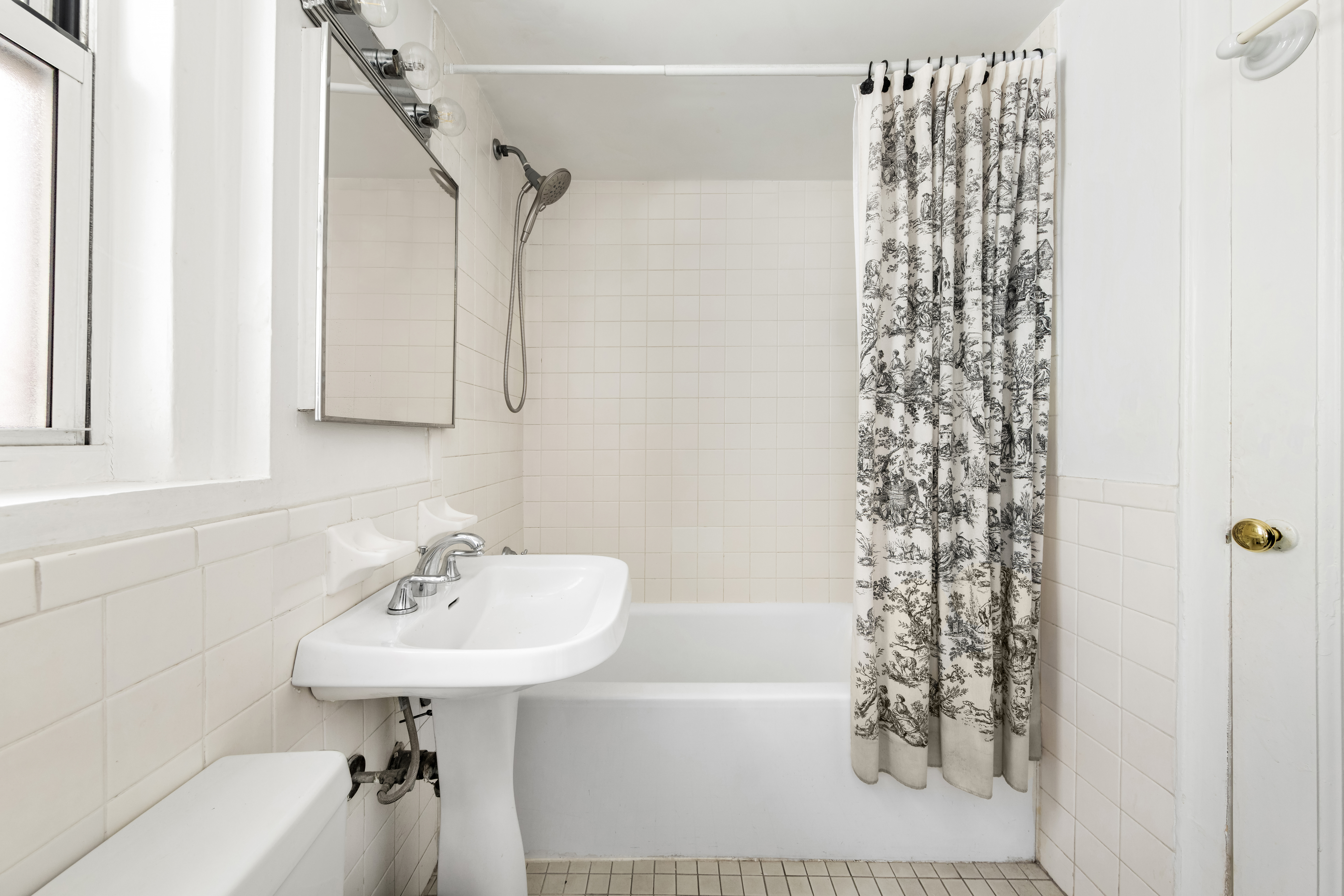 333 East 43rd Street, Unit 110/111 Manhattan, NY 10017 - Photo 6 of 16 a bathroom with a sink toilet and shower