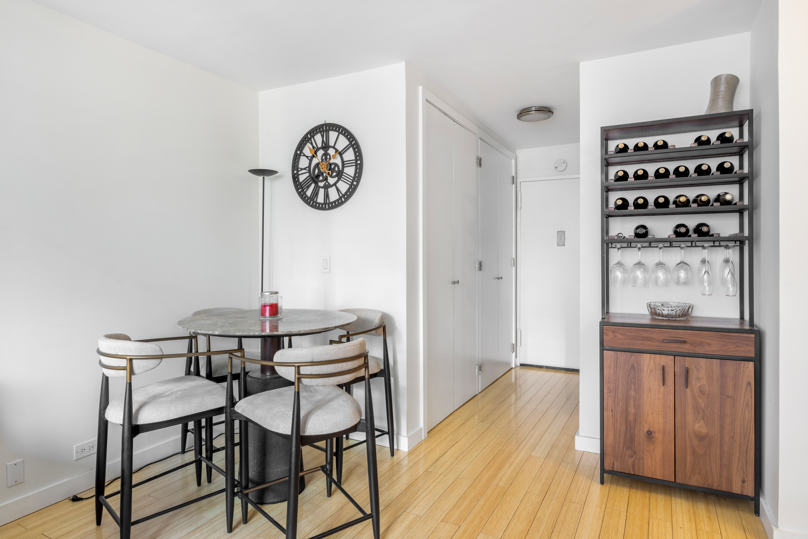 300 East 54th Street, Unit 23E Manhattan, NY 10022 - Photo 6 of 13 a view of a hallway with entryway wooden floor and front door