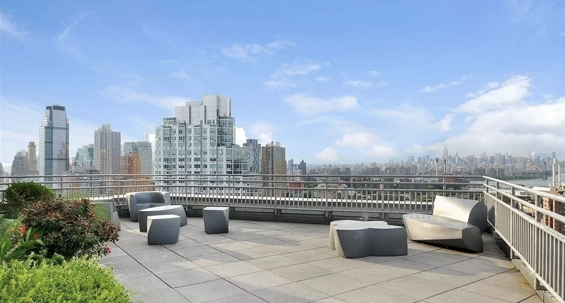 230 Ashland Place, Unit 22C Brooklyn, NY 11217 - Photo 9 of 13 a view of a roof with potted plants and city view