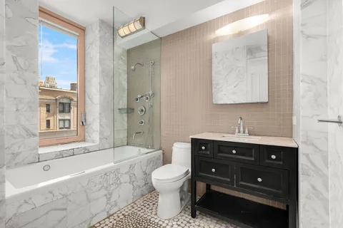 a bathroom with a sink a toilet and a bathtub