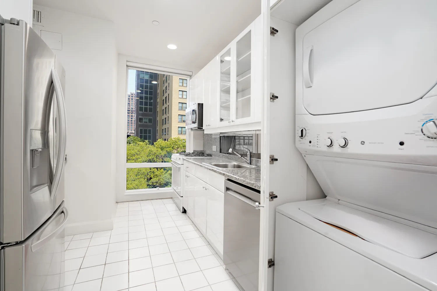 a kitchen with a refrigerator sink and stove