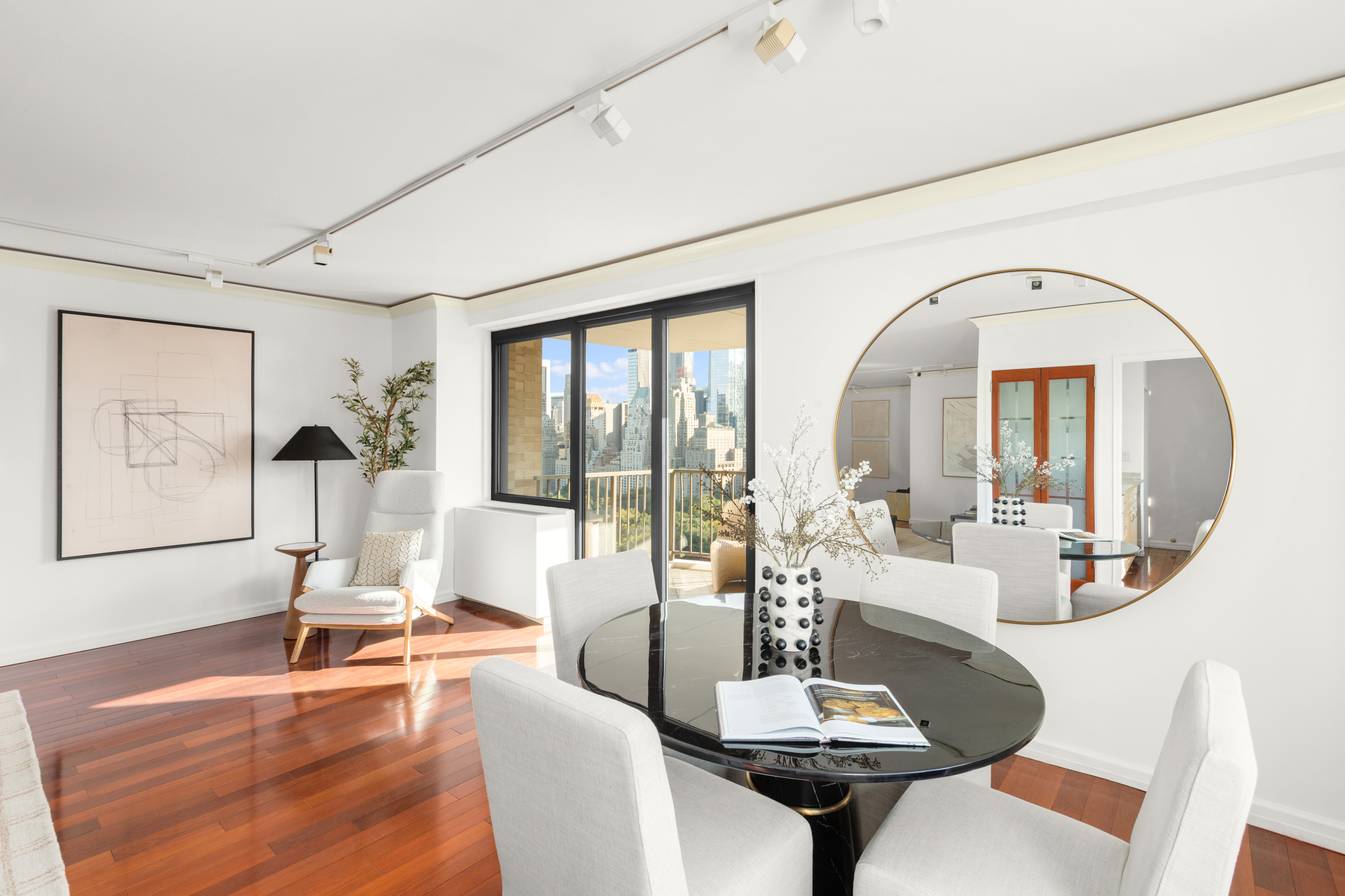 10 West 66th Street, Unit 29E Manhattan, NY 10023 - Photo 5 of 39 a living room with fireplace furniture and a large window