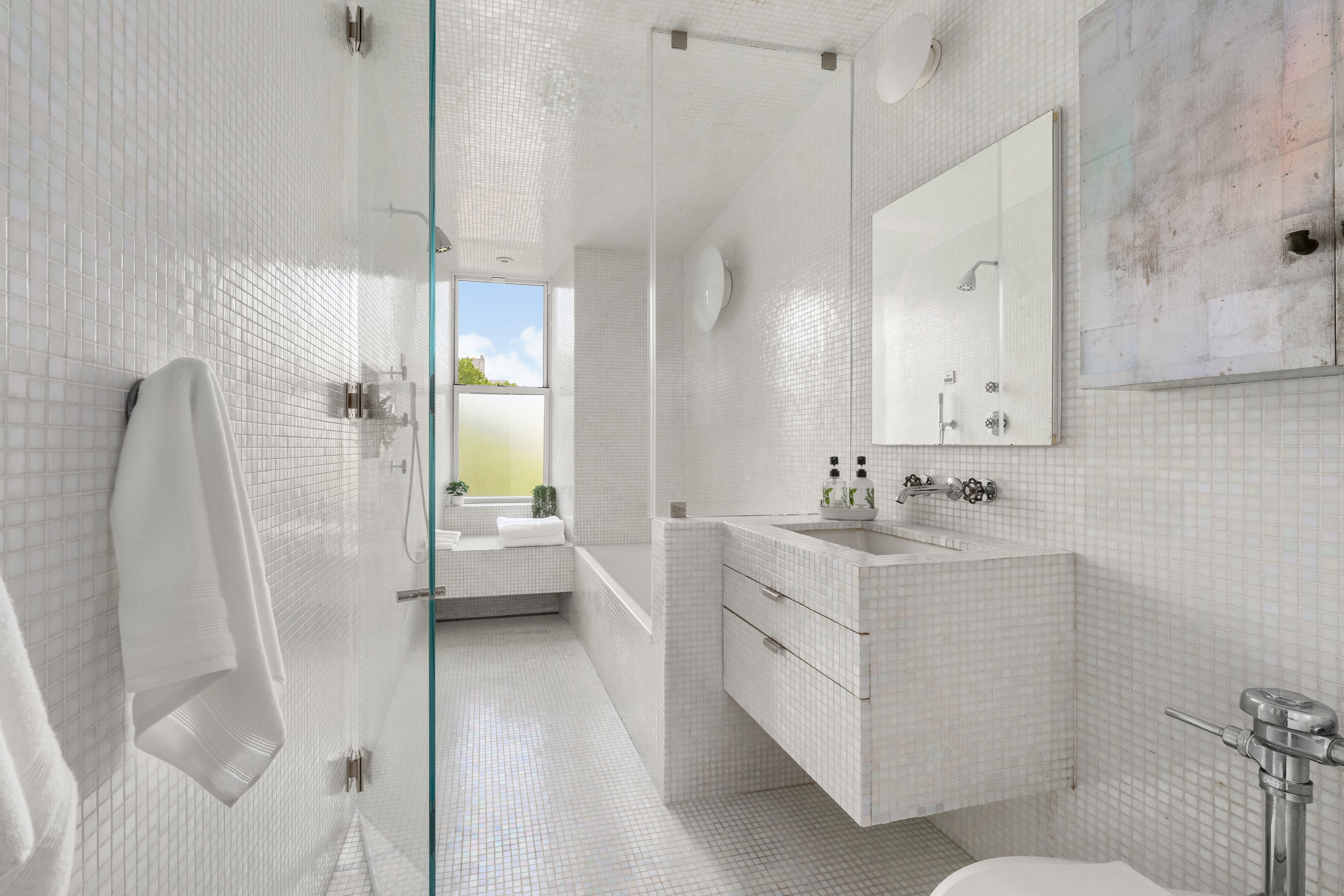 170 2nd Avenue, Unit 5A Manhattan, NY 10003 - Photo 7 of 12 a bathroom with a double vanity sink a toilet and a shower