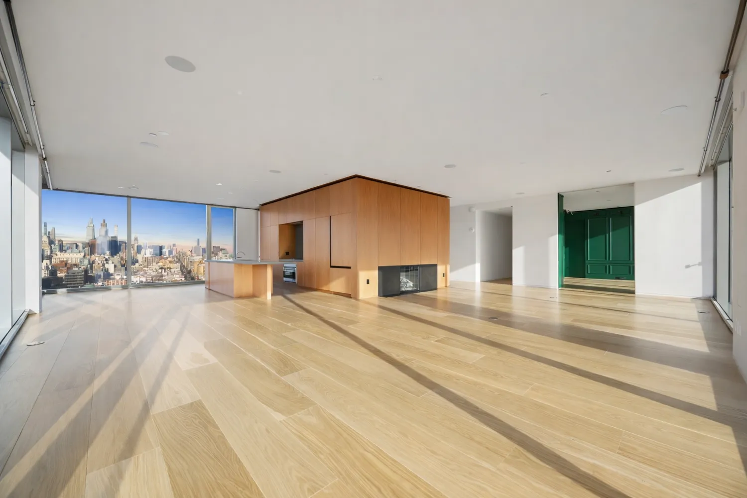 a view of a kitchen with kitchen island and living room