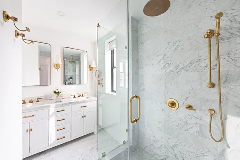 a bathroom with a granite countertop sink a shower and a mirror
