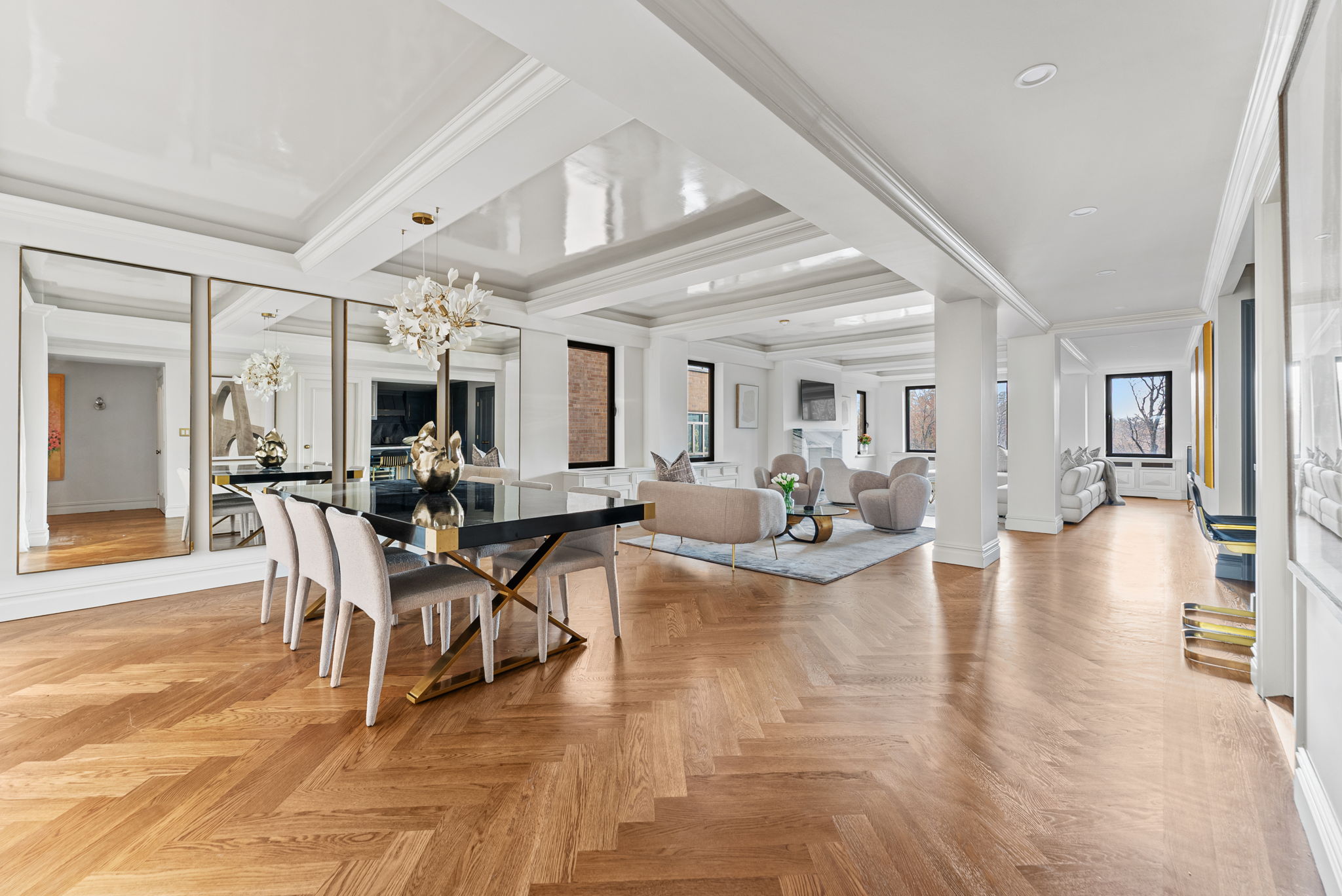 230 Central Park South, Unit 6DE Manhattan, NY 10019 - Photo 2 of 23 a view of a dining room with furniture a kitchen and chandelier