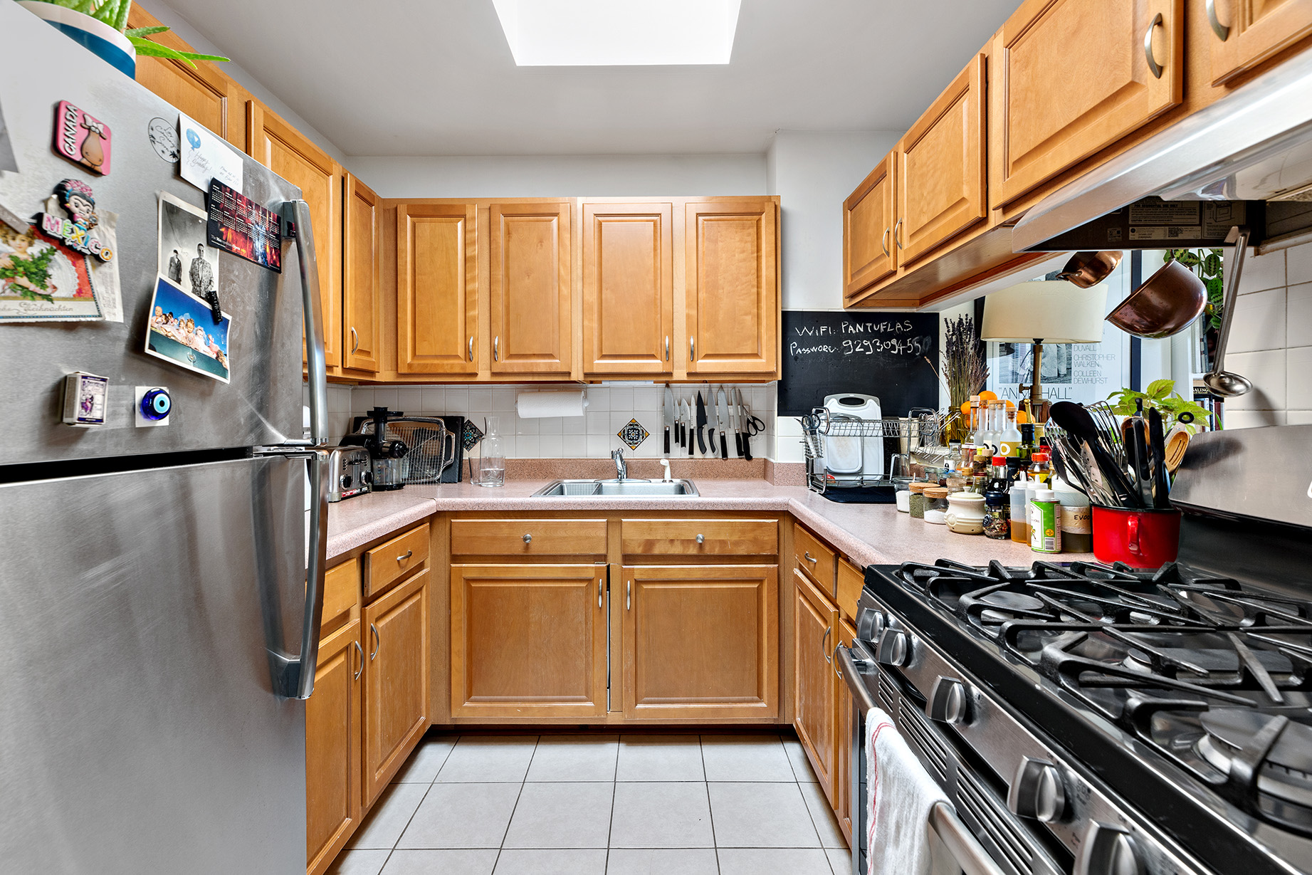 232 Monroe Street Brooklyn, NY 11216 - Photo 16 of 21 a kitchen with stainless steel appliances granite countertop a stove a sink and a refrigerator
