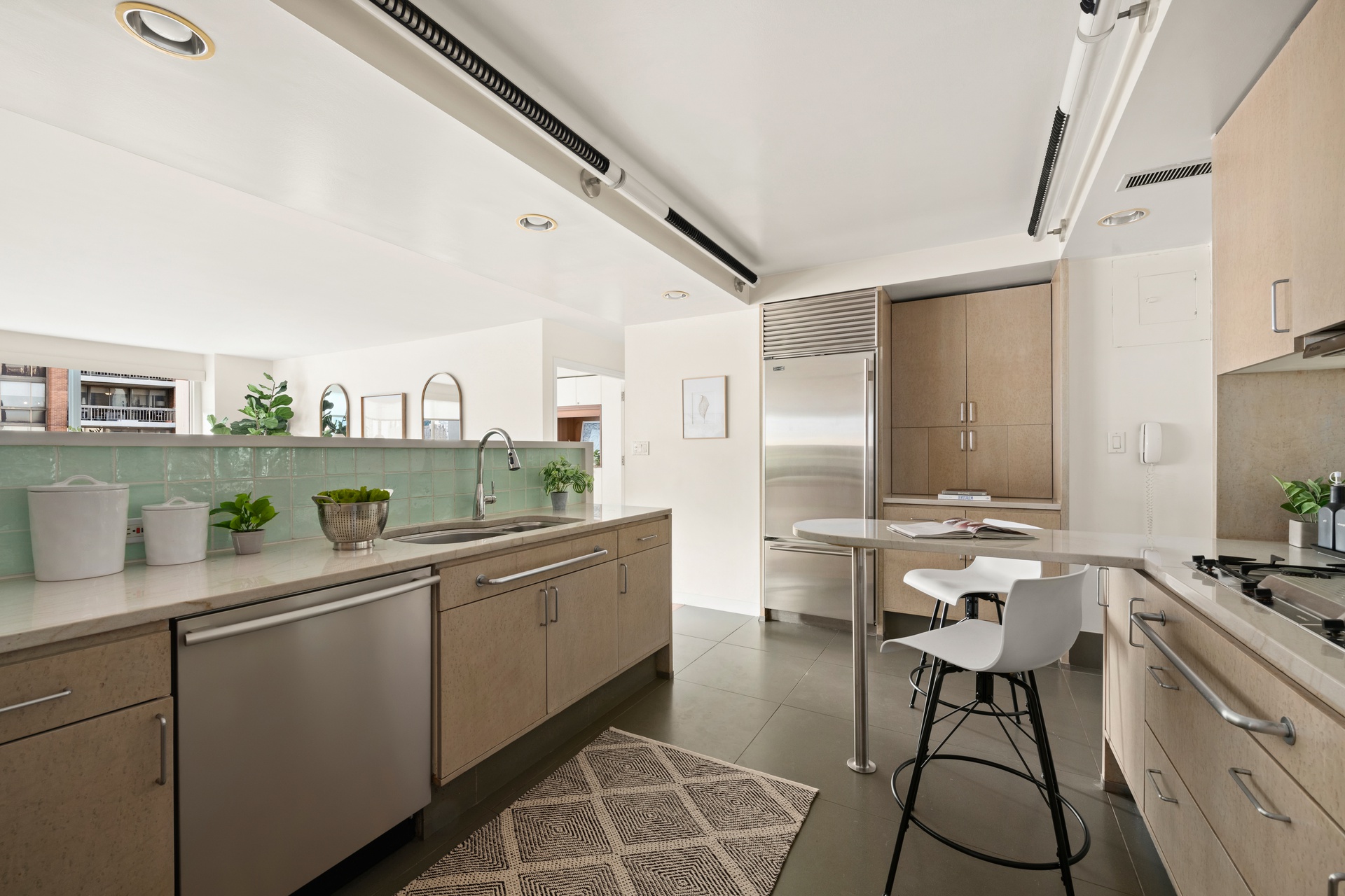 300 East 59th Street, Unit 2103 Manhattan, NY 10022 - Photo 5 of 14 a room with furniture a rug and white walls