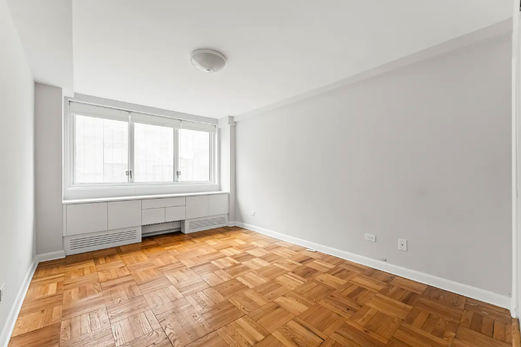 20 East 68th Street, Unit 11B Manhattan, NY 10065 - Photo 4 of 10 an empty room with a window