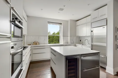 a kitchen with a sink stove and refrigerator