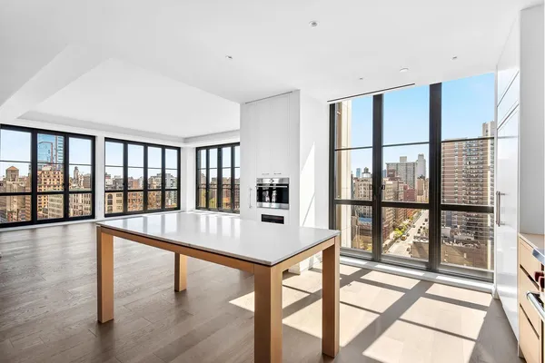 a view of a furniture window and wooden floor