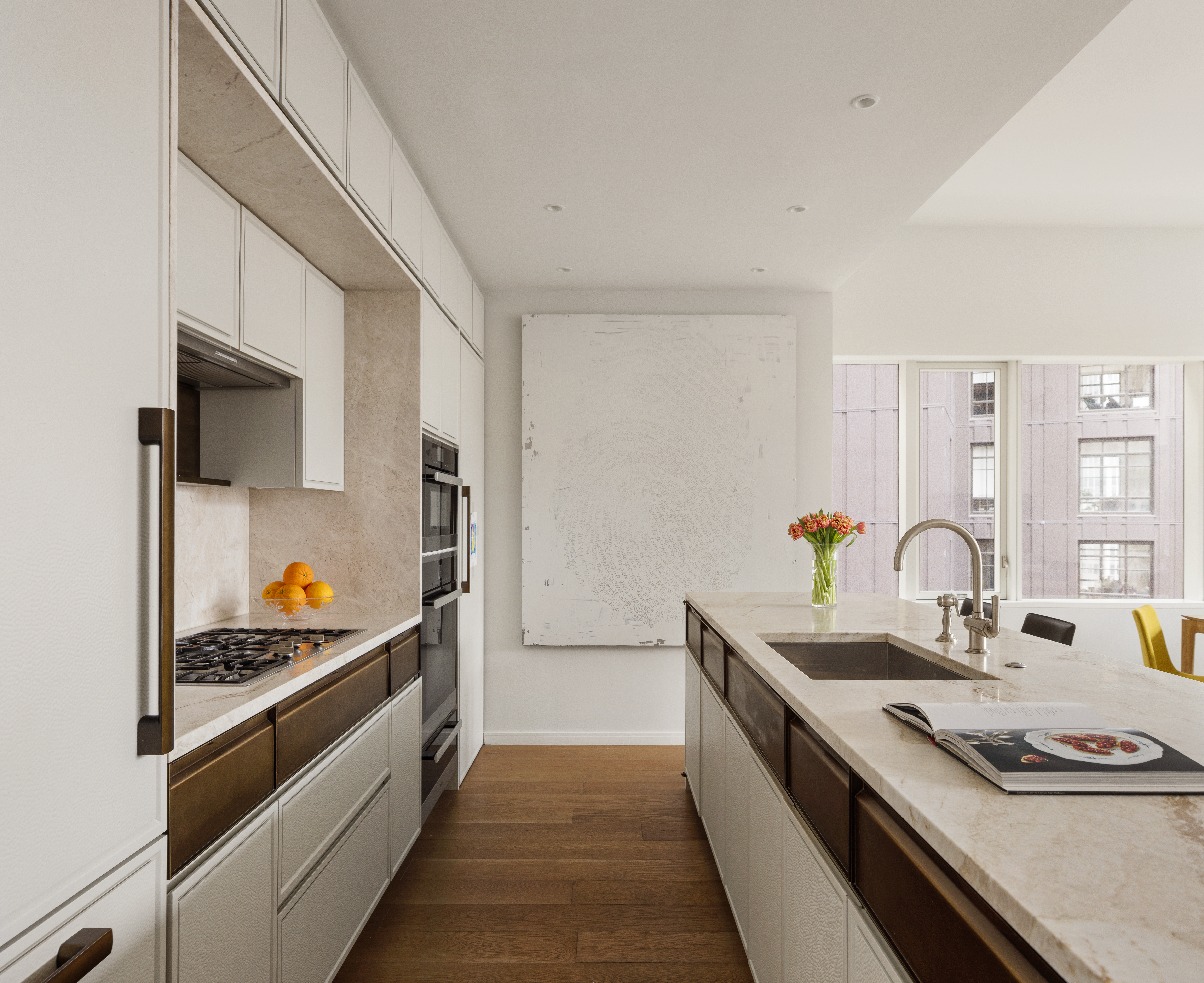 121 Nassau Street, Unit 17A Manhattan, NY 10038 - Photo 4 of 19 a kitchen with stainless steel appliances granite countertop a sink and a stove