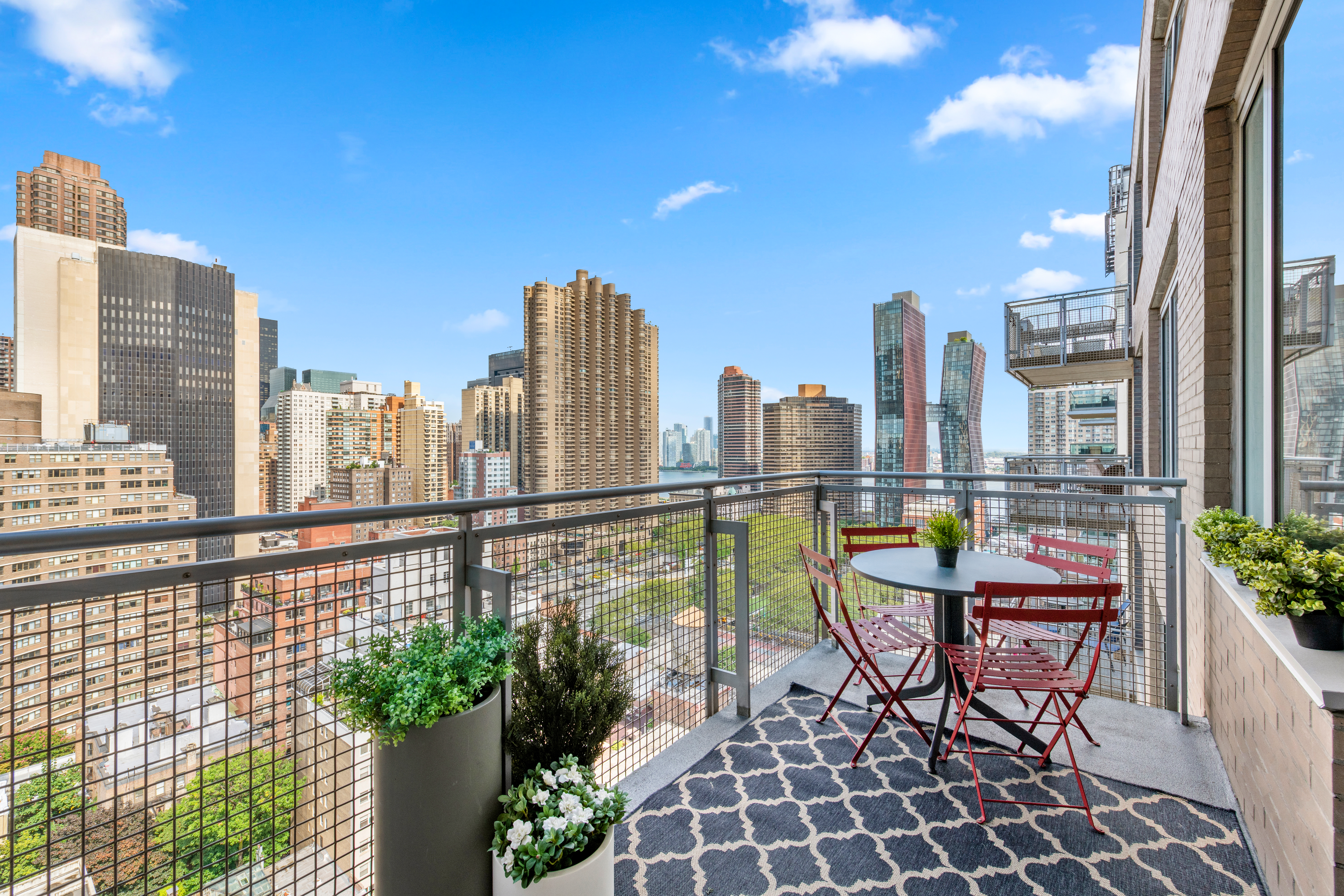 225 East 34th Street, Unit 21I Manhattan, NY 10016 - Photo 8 of 24 a view of a balcony with chairs
