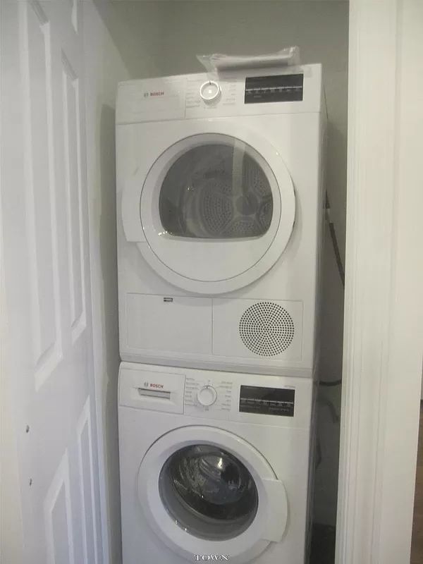 328 West 19th Street, Unit 1B Manhattan, NY 10011 - Photo 9 of 11 a utility room with dryer and washer