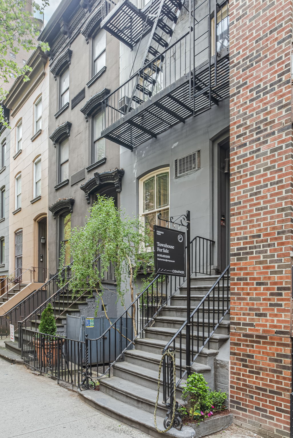 206 East 30th Street Manhattan, NY 10016 - Photo 3 of 21 a view of a brick house with many windows