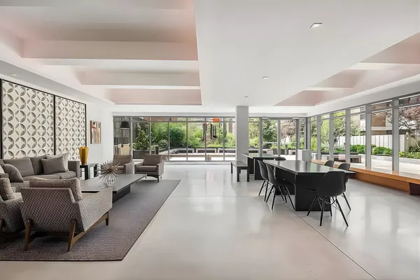 a view of a city street lined with buildings and cars