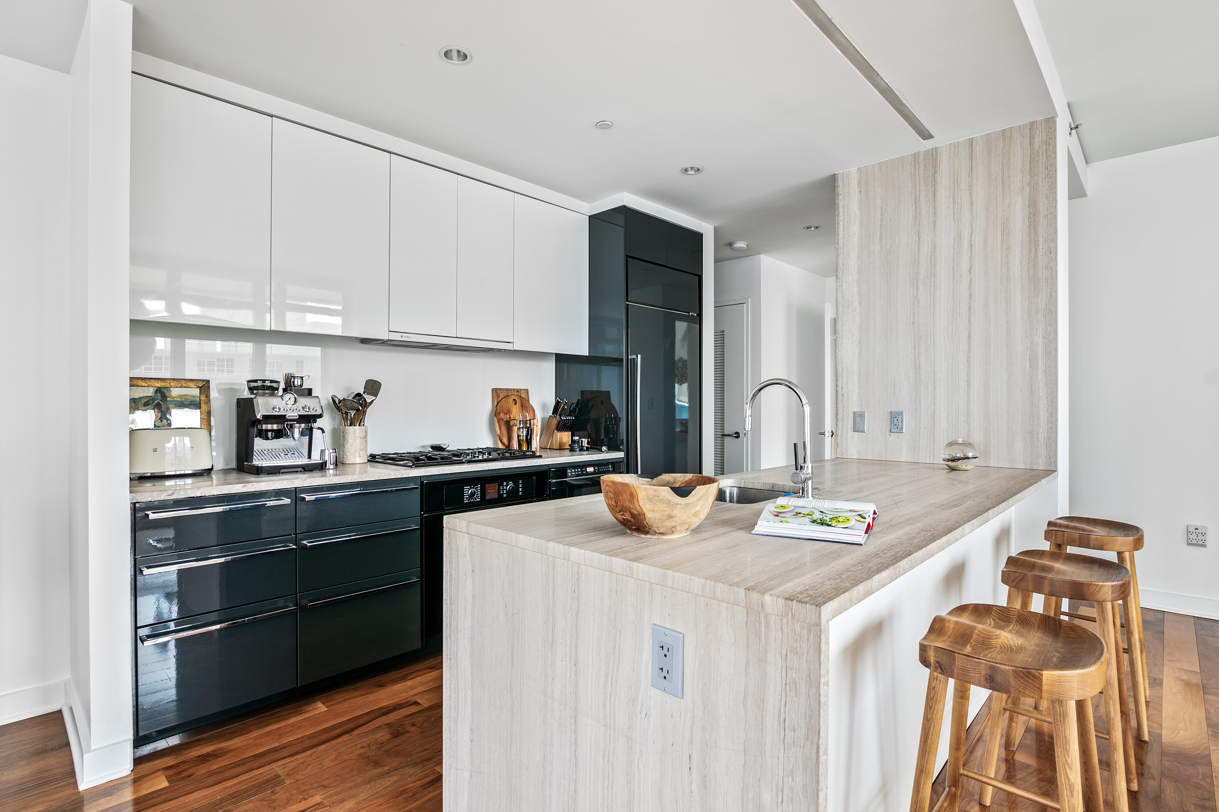 2 Northside Piers, Unit 17A Brooklyn, NY 11249 - Photo 4 of 21 a kitchen with stainless steel appliances granite countertop a sink stove and cabinets