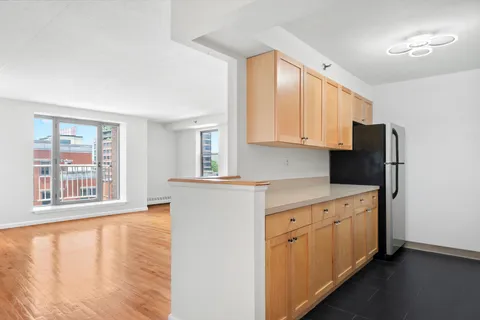 a utility room with cabinets washer and dryer