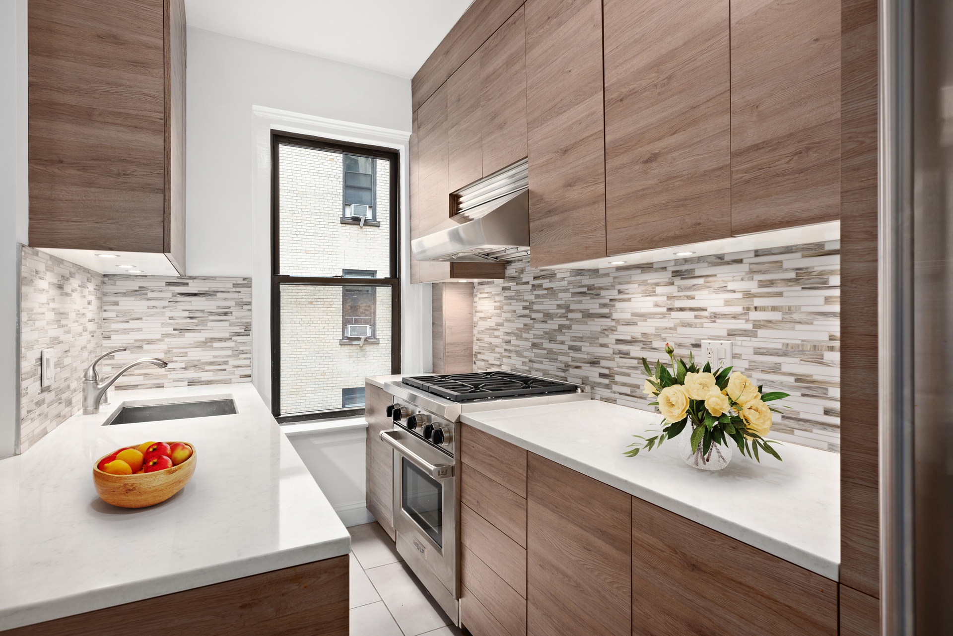 65 Morton Street, Unit 2N Manhattan, NY 10014 - Photo 4 of 12 a kitchen with a sink appliances and cabinets