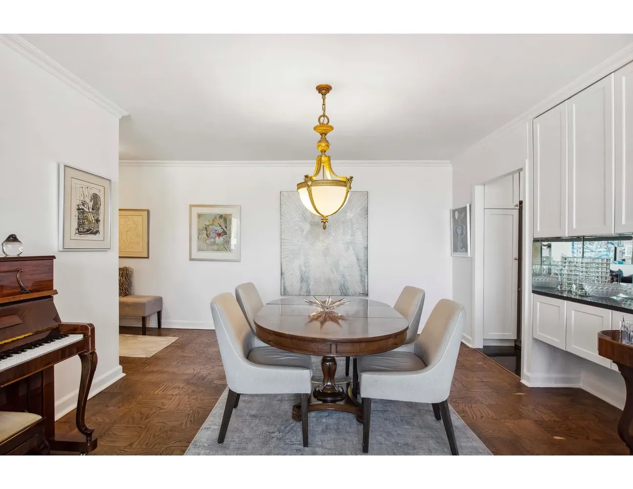 a dining room with furniture window and wooden floor