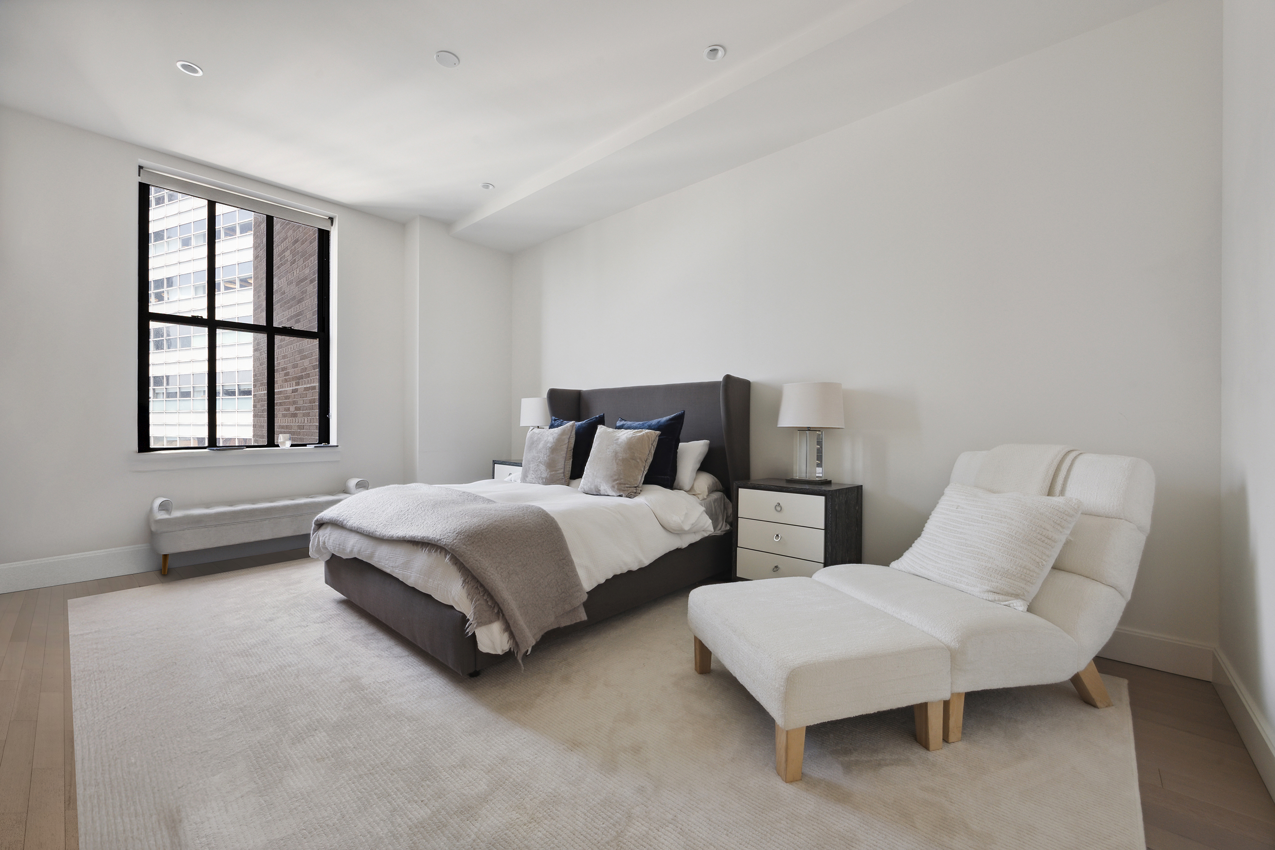 100 Barclay Street, Unit 15B Manhattan, NY 10007 - Photo 9 of 16 a spacious bedroom with two beds and windows