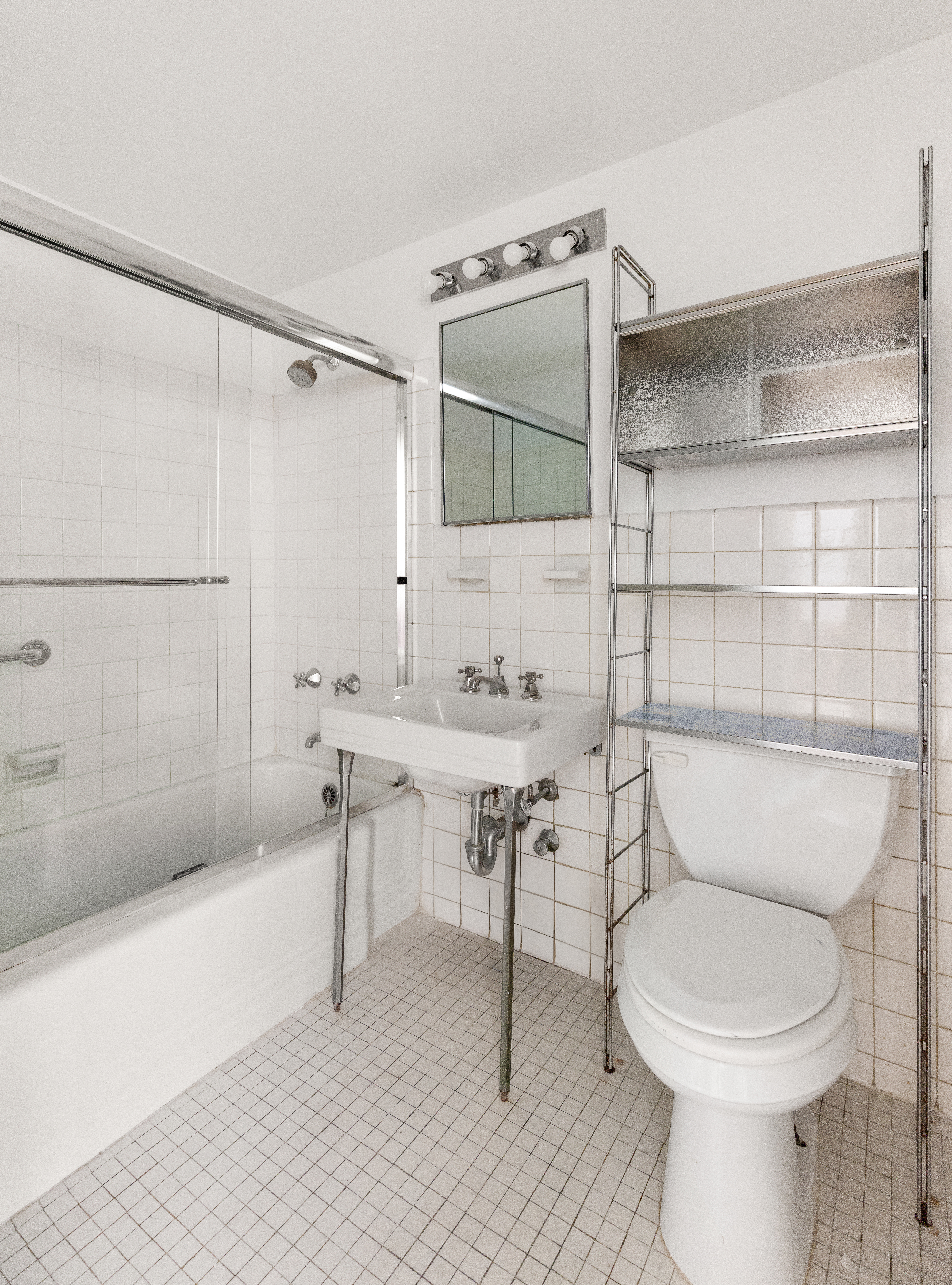 11 5th Avenue, Unit 3R Manhattan, NY 10003 - Photo 8 of 12 a bathroom with a sink toilet and shower