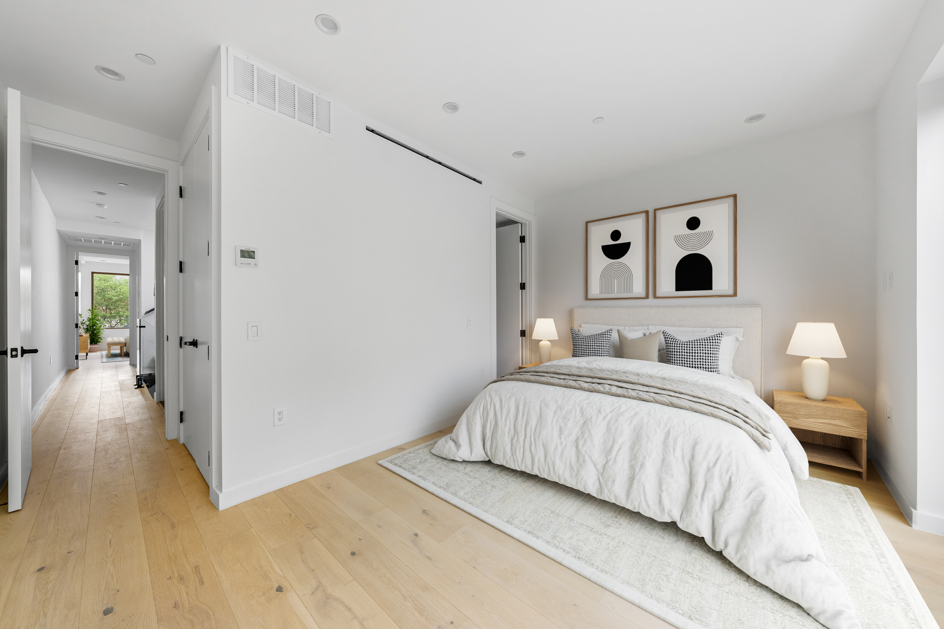 545 Lexington Avenue, Unit 2 Brooklyn, NY 11221 - Photo 9 of 23 a bedroom with a bed and a view of bathroom