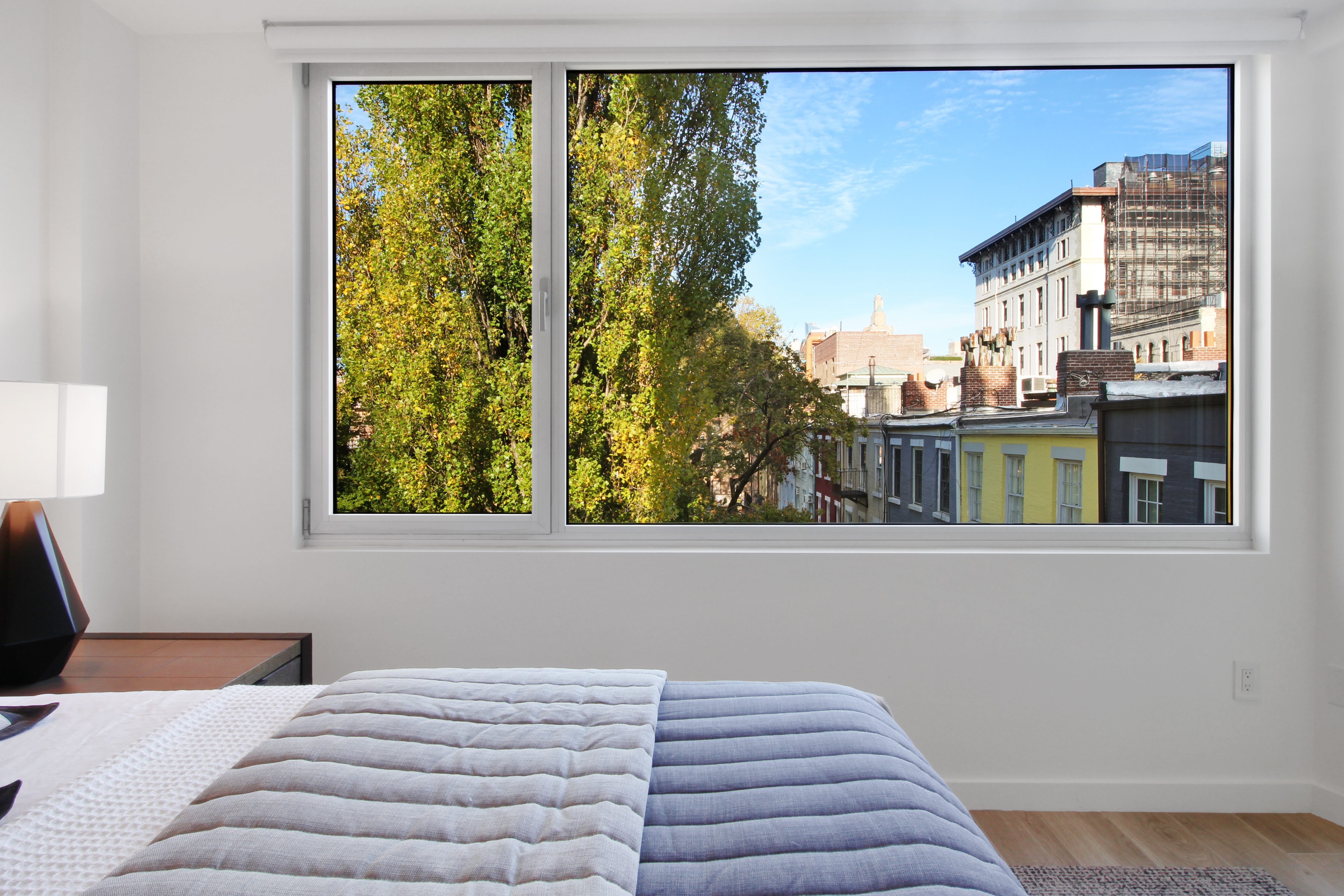 136 West Houston Street, Unit 4 Manhattan, NY 10012 - Photo 6 of 14 a bedroom with a bed and a window