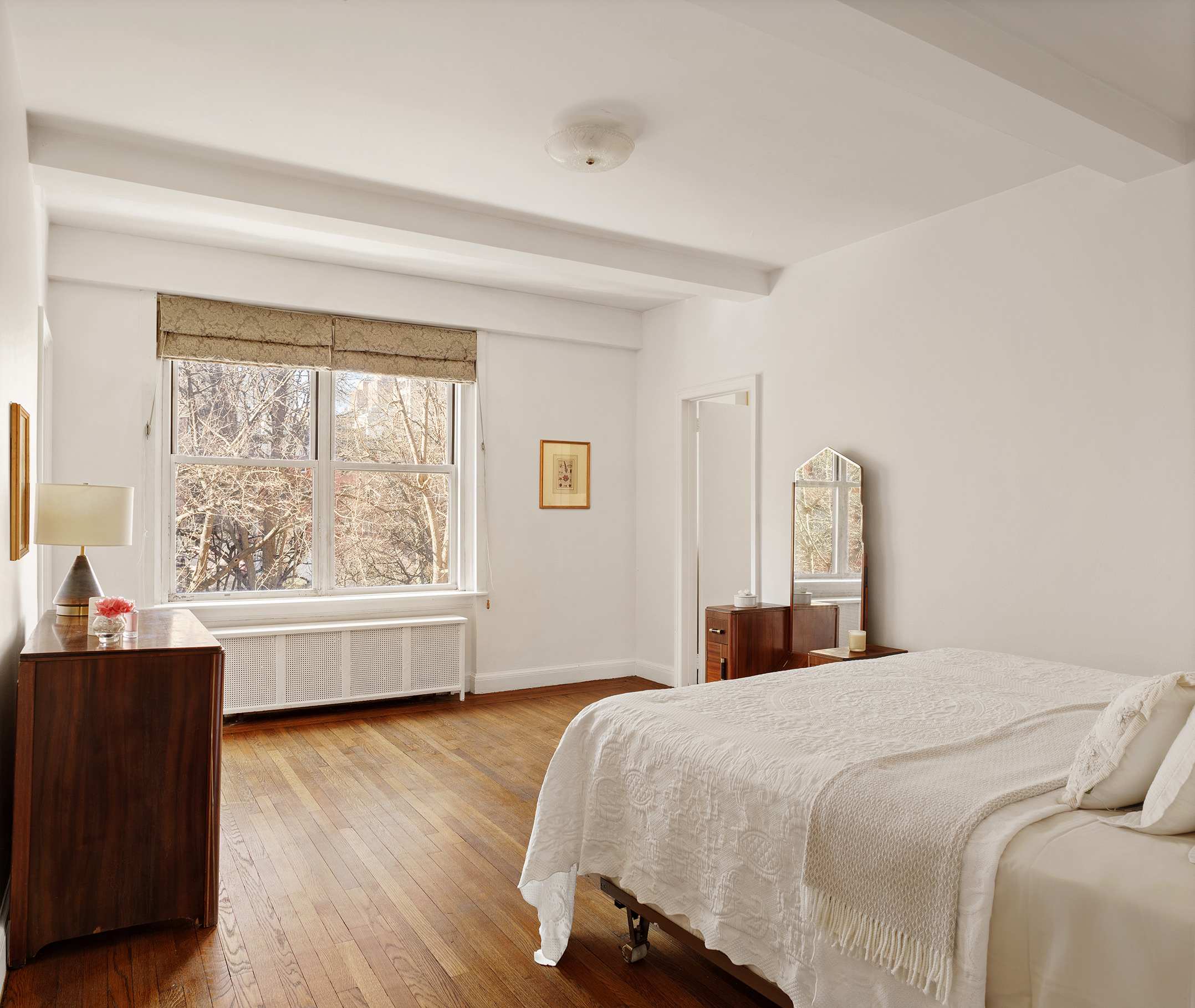 45 Gramercy Park North, Unit 4B Manhattan, NY 10010 - Photo 5 of 13 a bedroom with a large bed and a large window