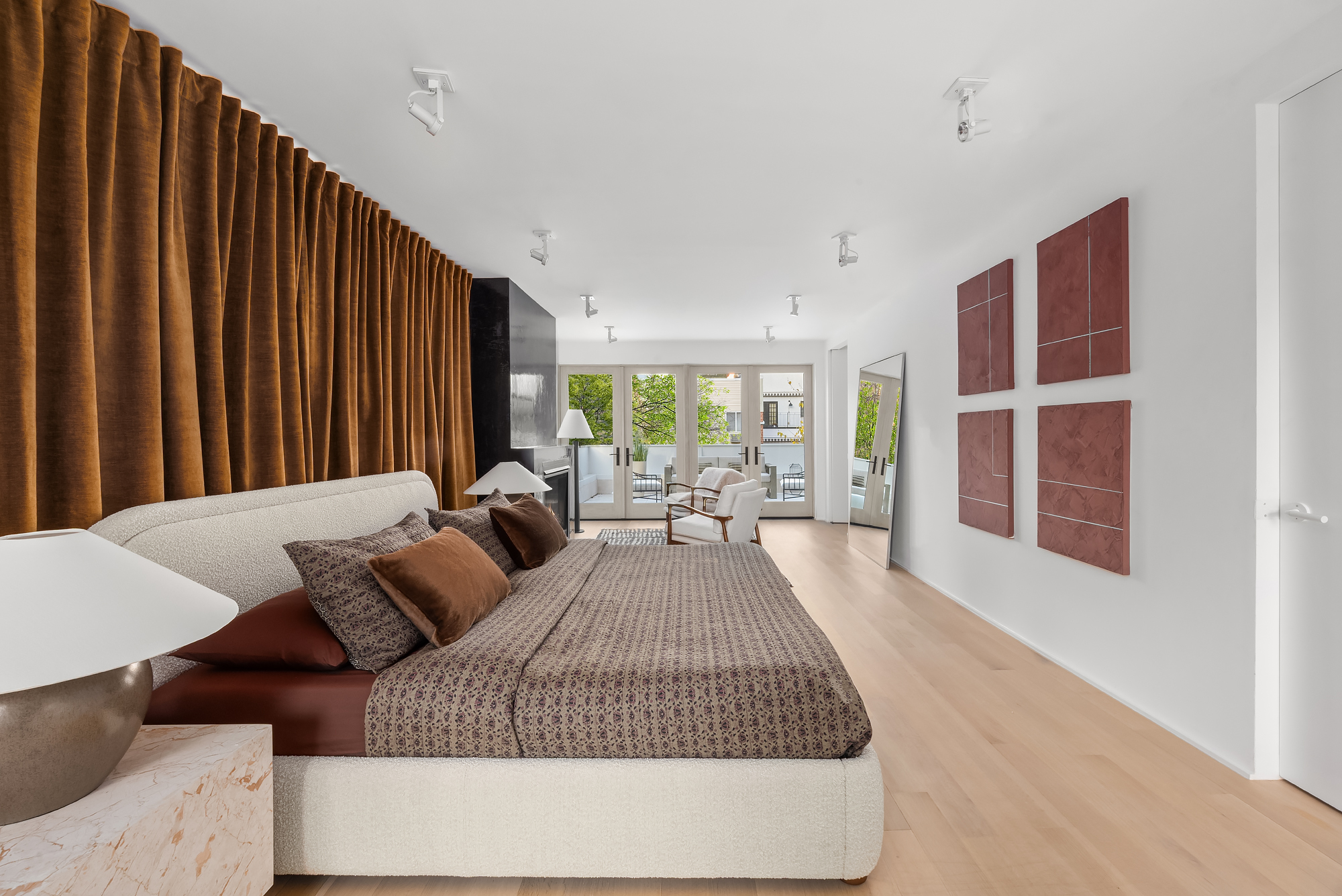 61 South 4th Street Brooklyn, NY 11249 - Photo 13 of 29 a bed sitting in a spacious bedroom next to a window