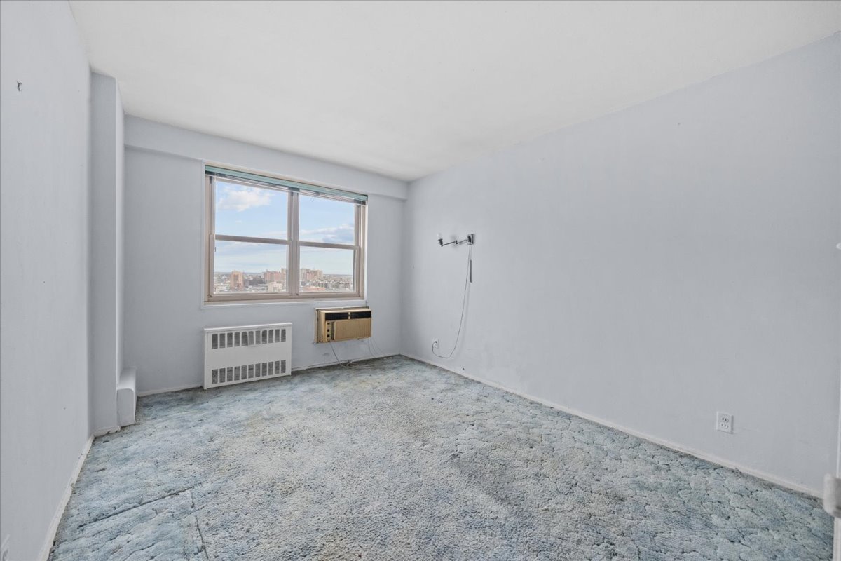448 Neptune Avenue, Unit 16K Brooklyn, NY 11224 - Photo 10 of 28 an empty room with windows
